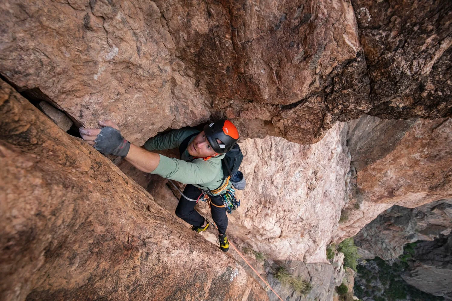 A guide leads up a crack in a band of pegmatite on the North Rim of the Black Canyon.