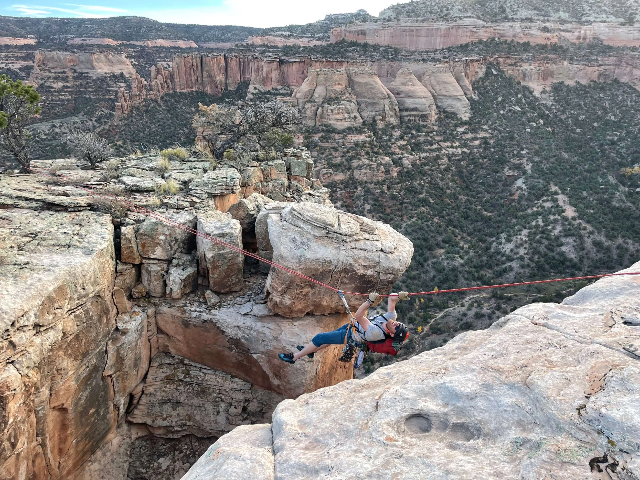 A tyrolean traverse between two summits.