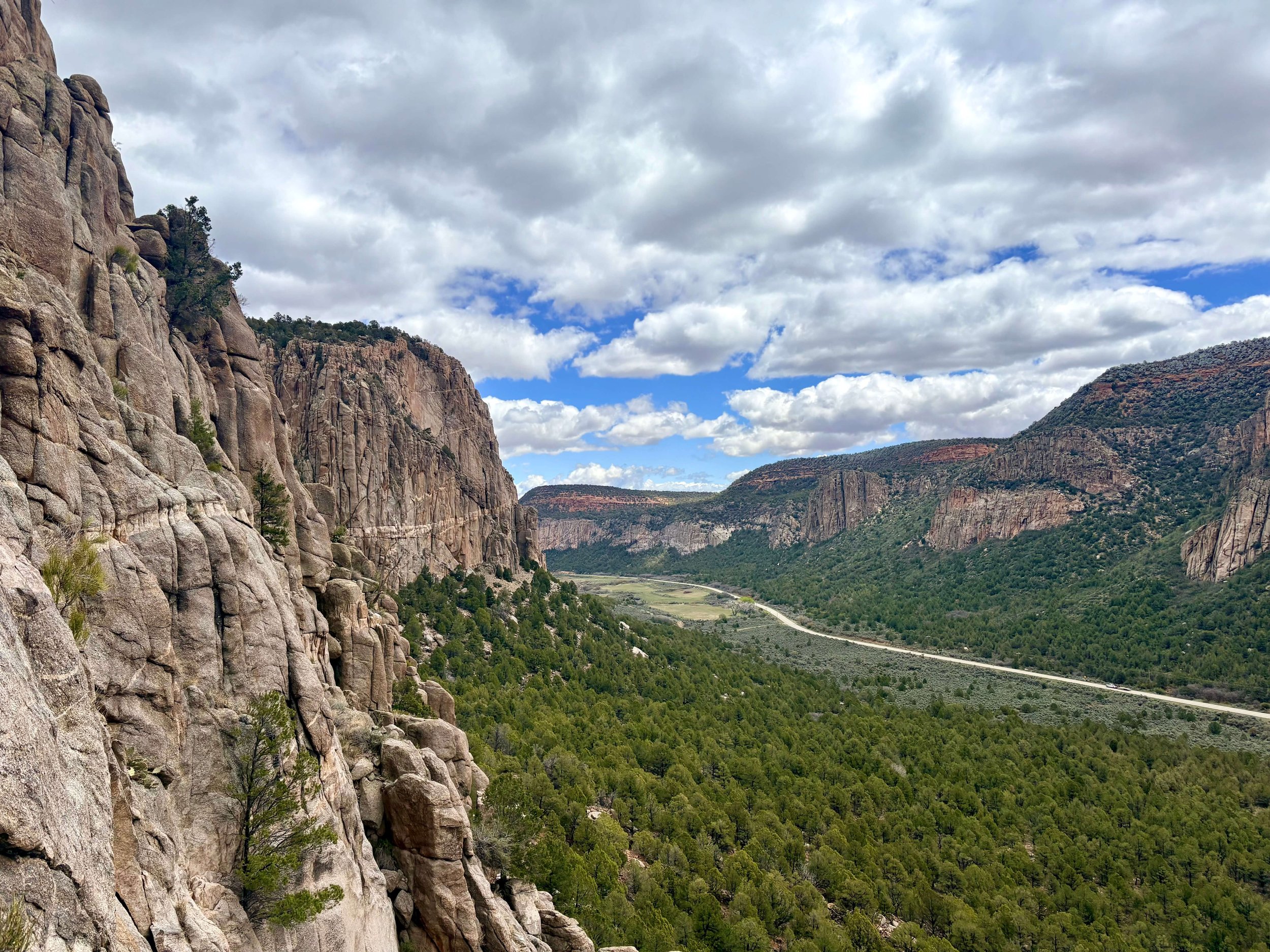 A view of Unaweep Canyon with steep granite cliffs.