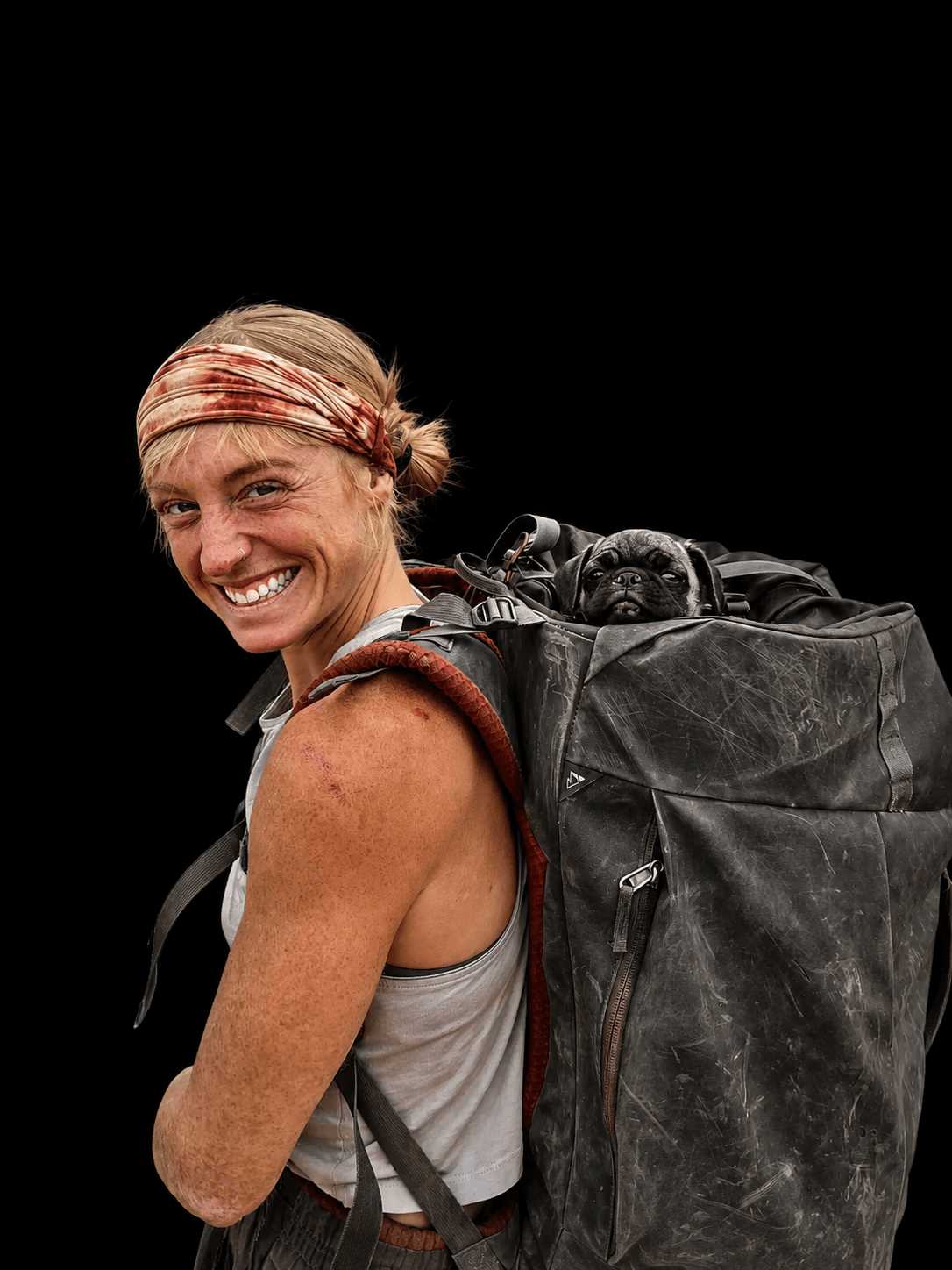 Skyward Mountaineering guide, Carly Casternovia. She is wearing a backpack with a pug dog sticking it's head out.