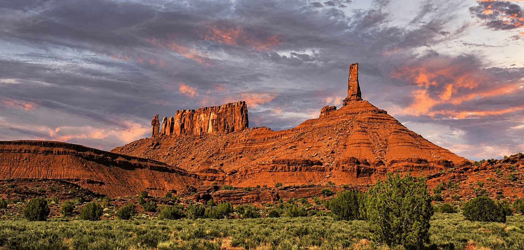 A view of Castle Valley, outside of Moab, Utah with Castleton Tower rising prominently above the mesa.