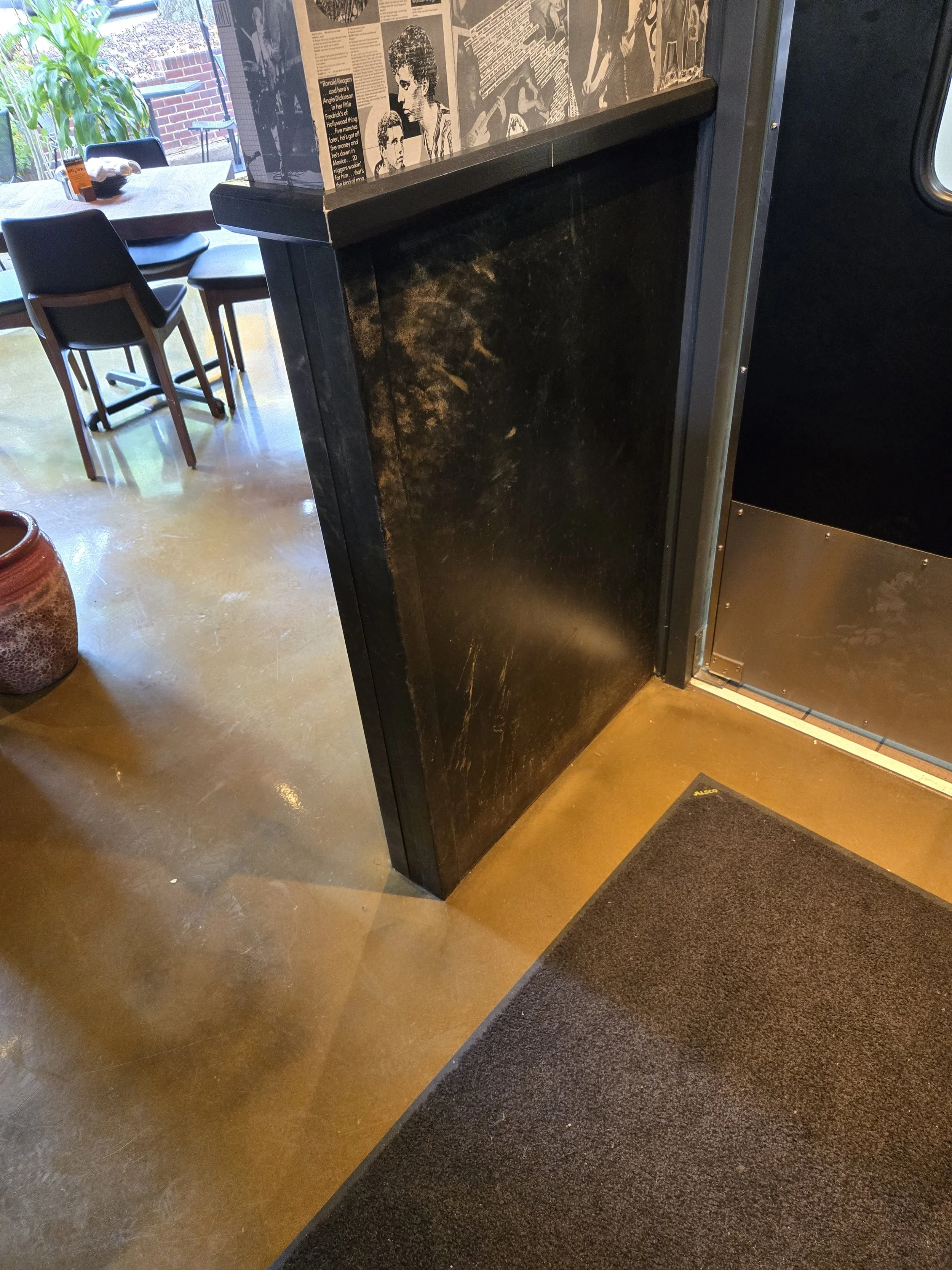 Chemically blackened steel wainscoting.
