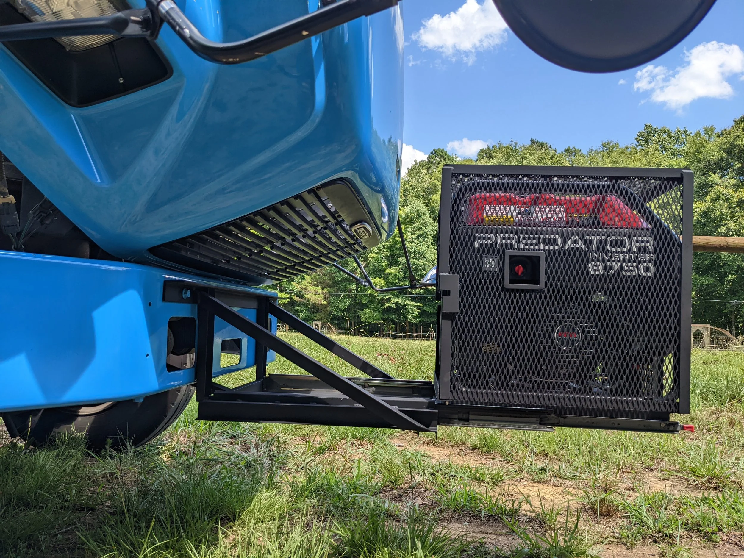 Generator enclosure on siding base for hood access.
