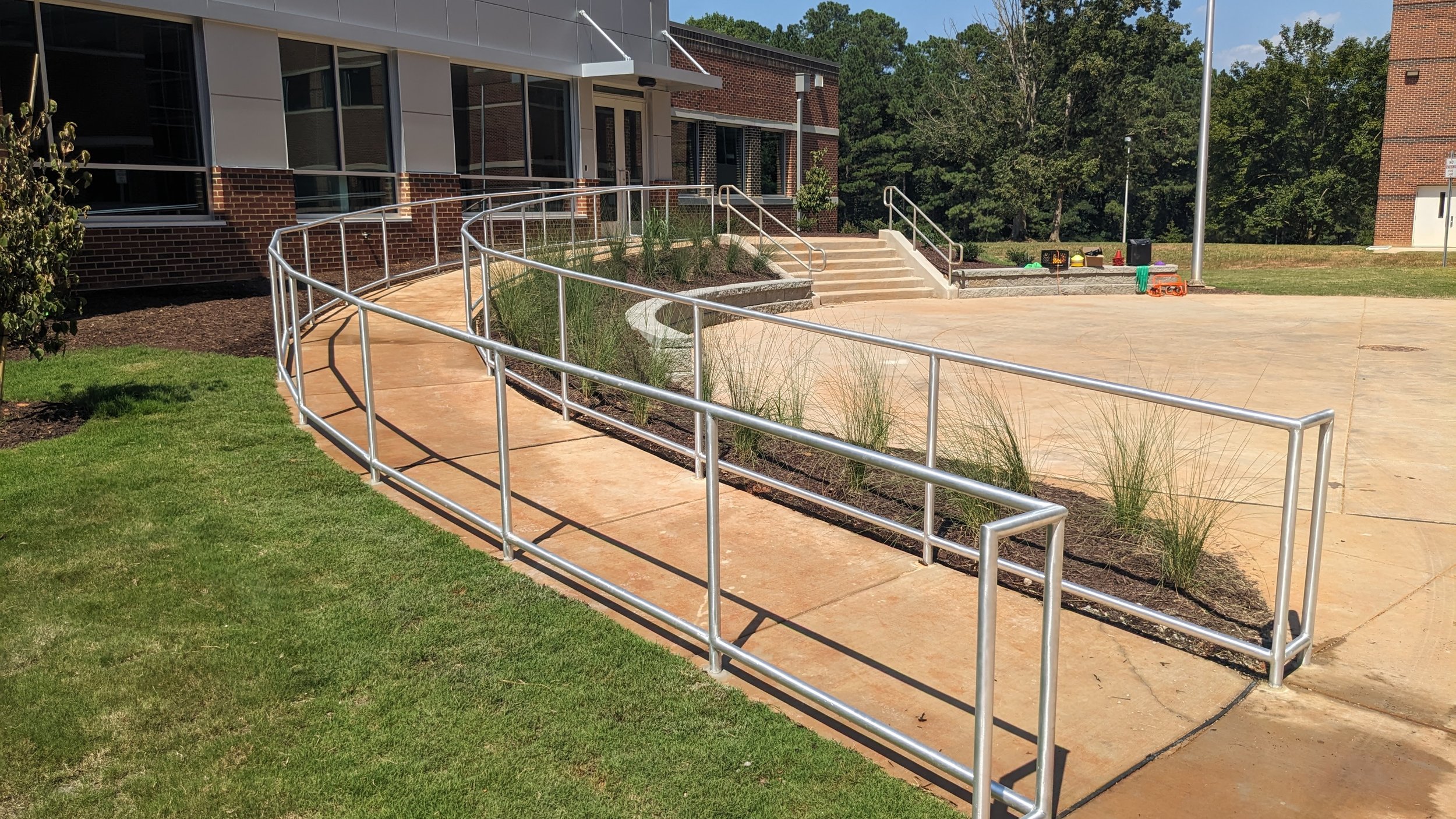 Aluminum code required rails on a radiused ramp