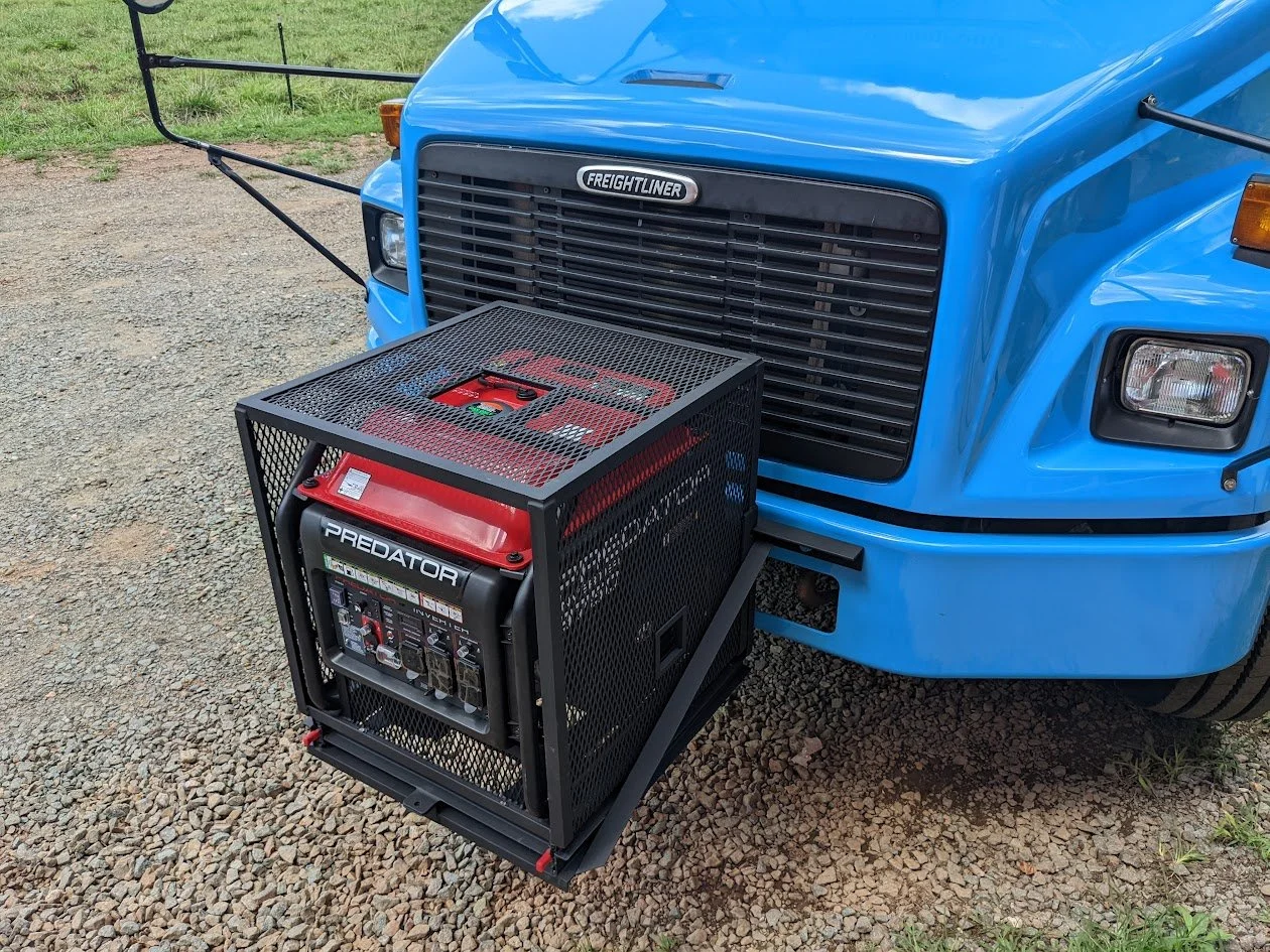 Generator enclosure on siding base for hood access.