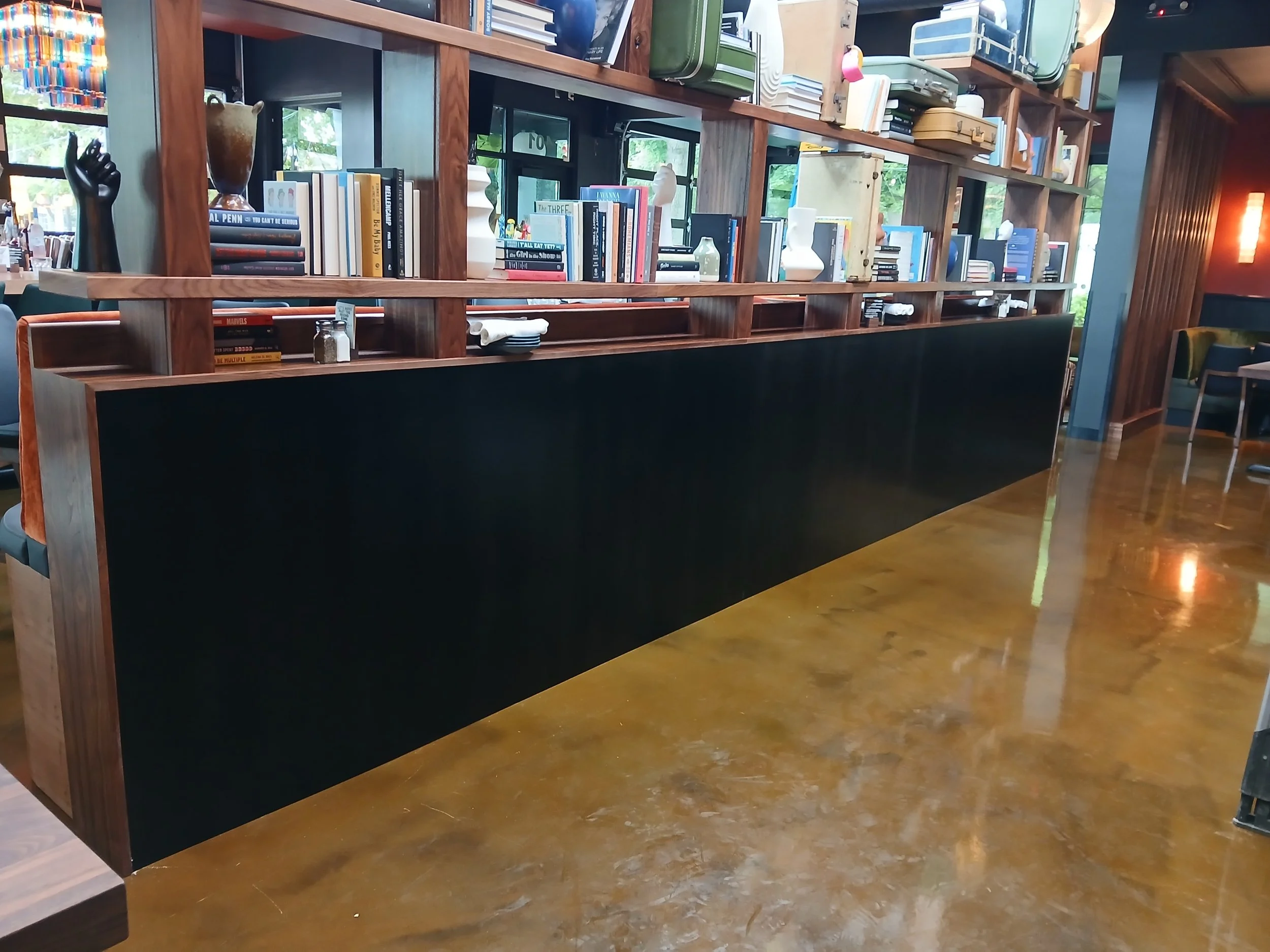Chemically blackened steel wainscoting.