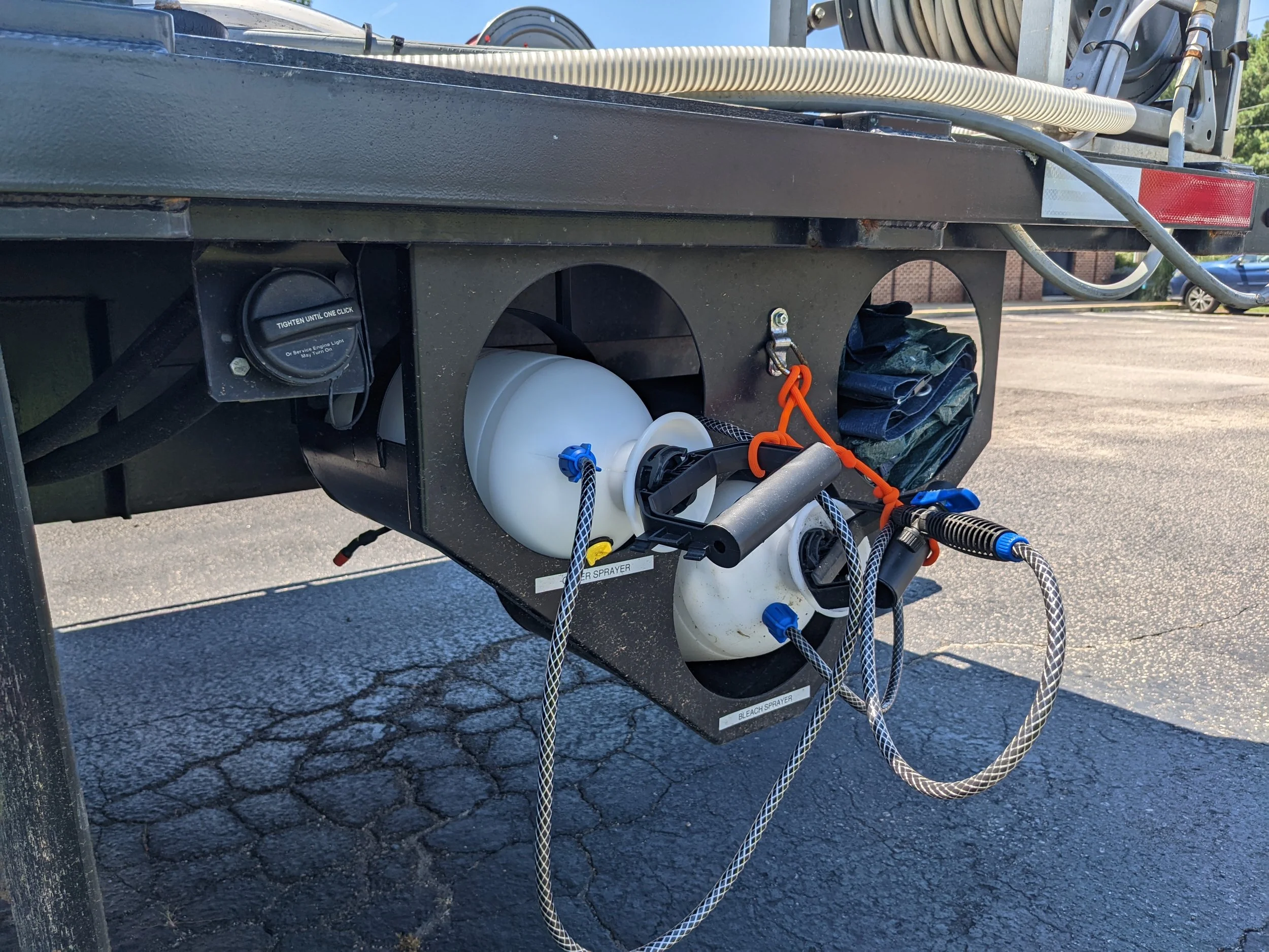 Spray bottle holder for commercial power washing upfit