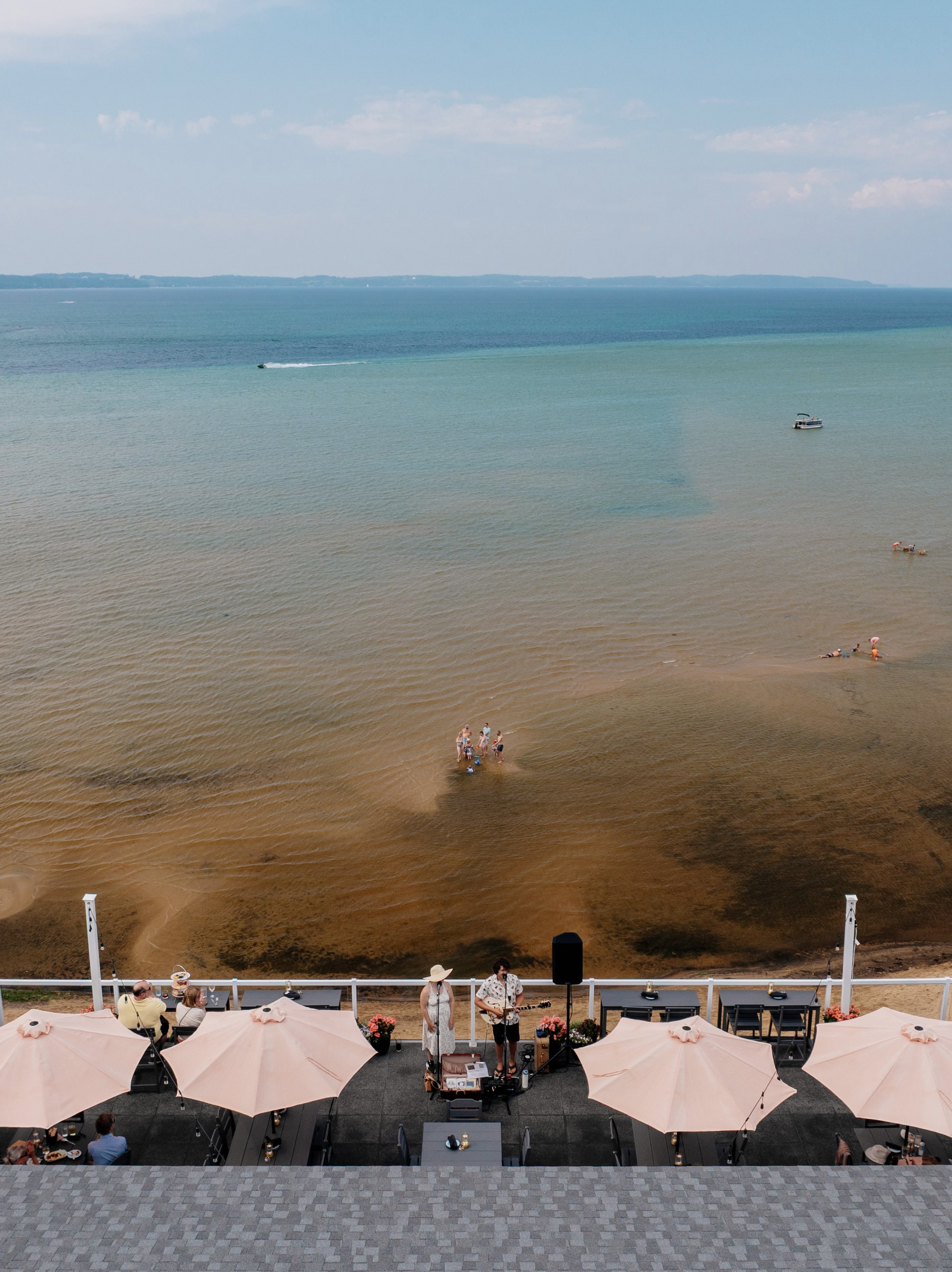 Live music at Blush Rooftop Terrace overlooking East Grand Traverse Bay
