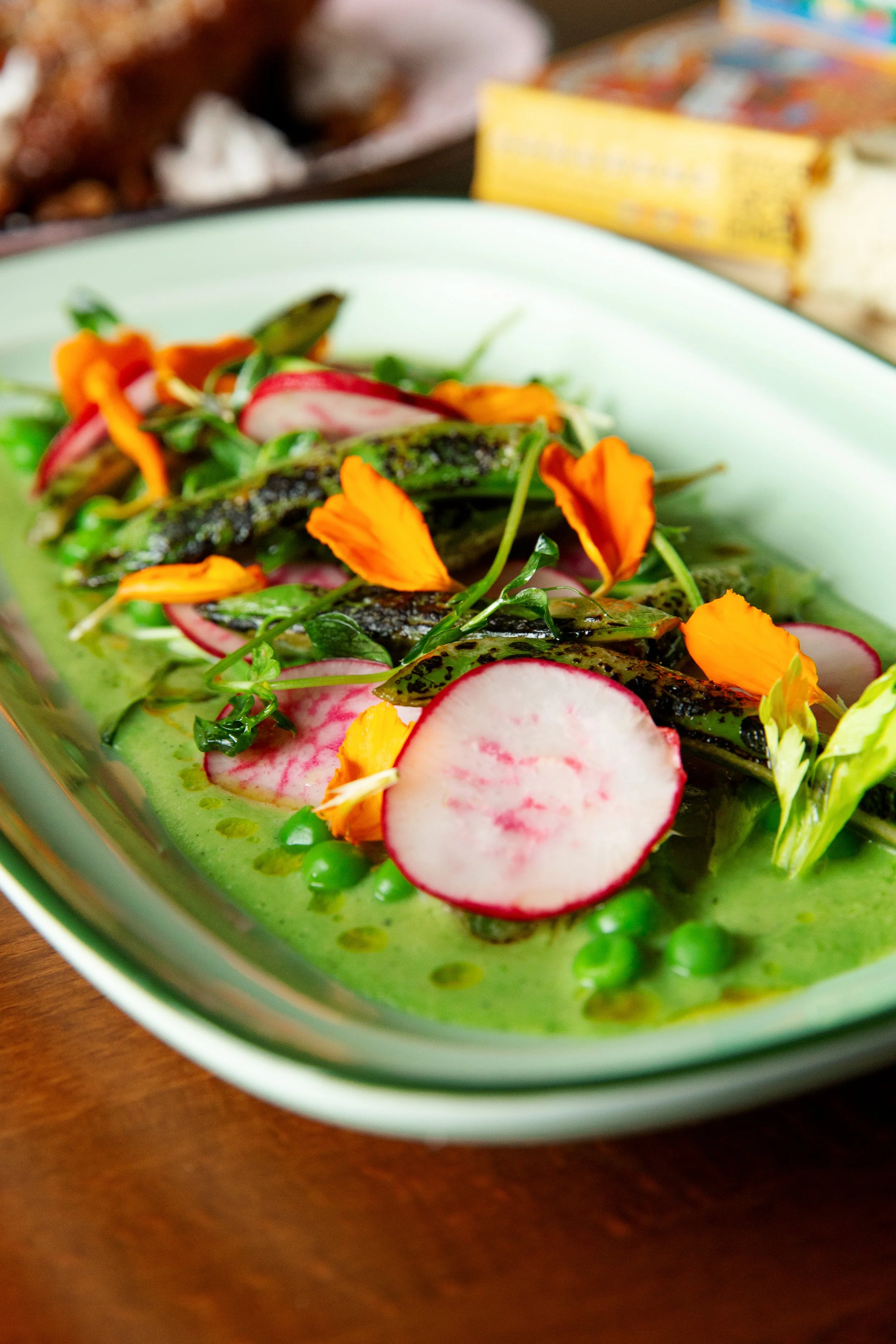 Spring pea and radish salad available at Blush Rooftop Terrace in Traverse City