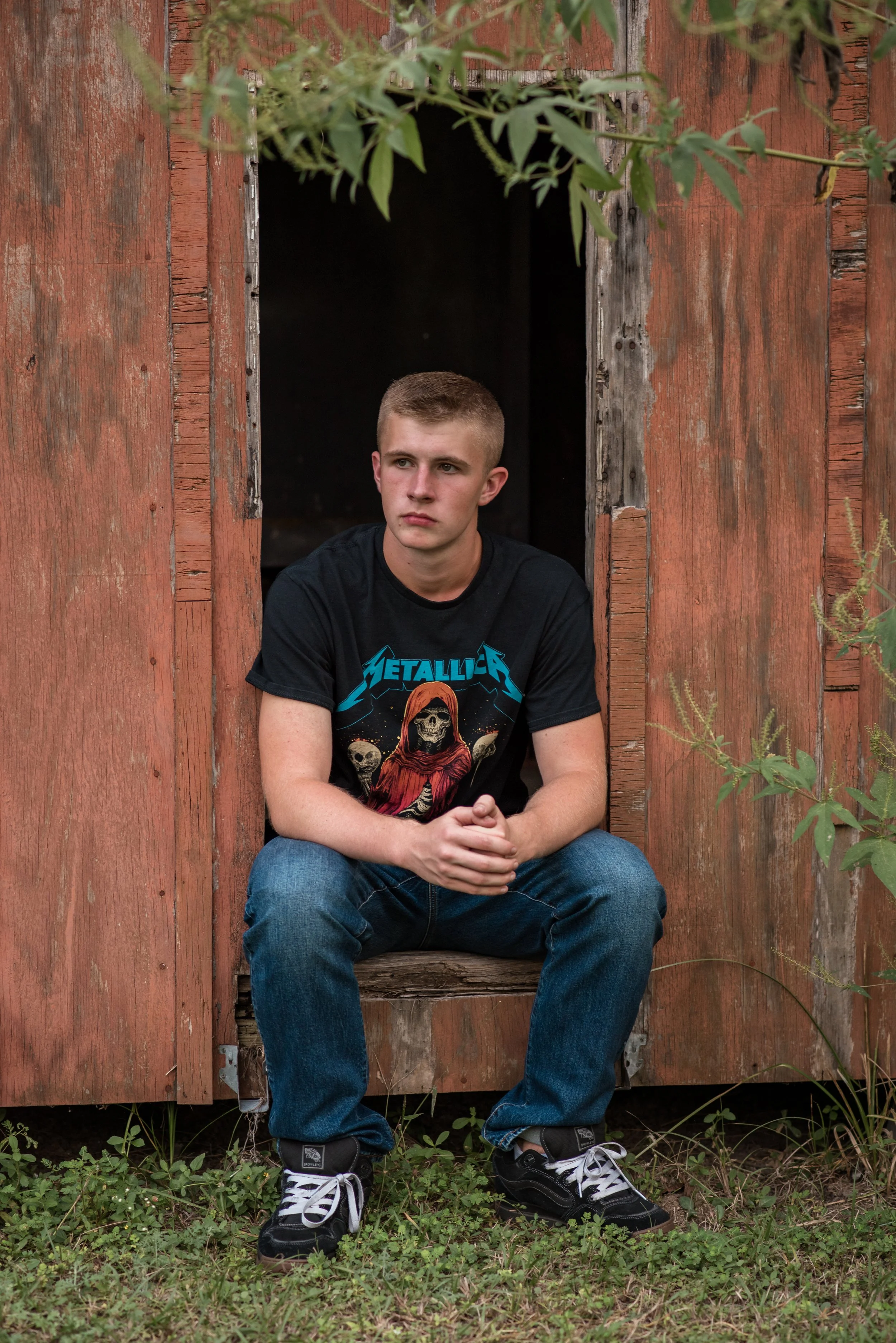 A high school boy at a rustic country location