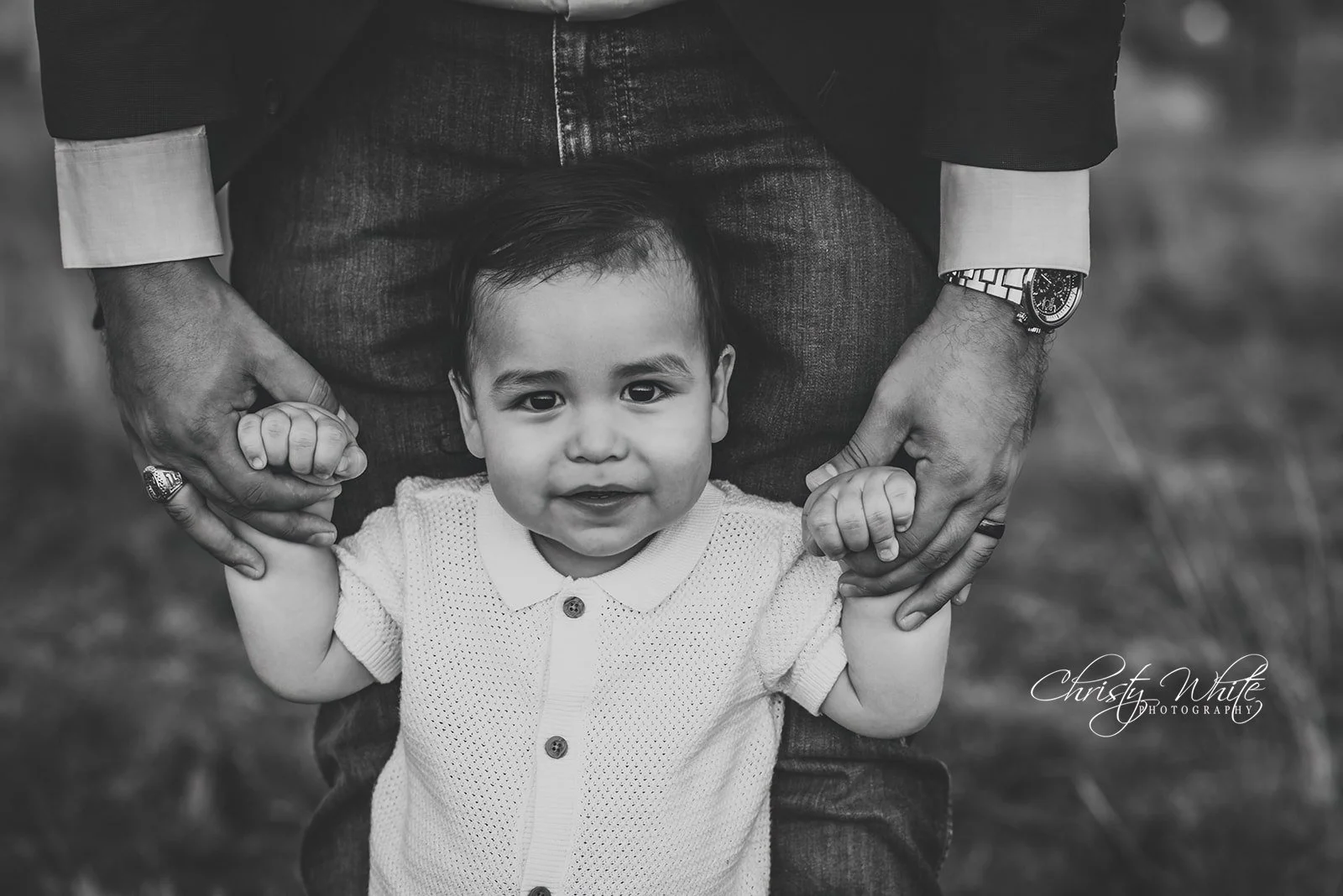 Young child smiling in outdoor setting during lifestyle natural child photography session in Alvin Texas