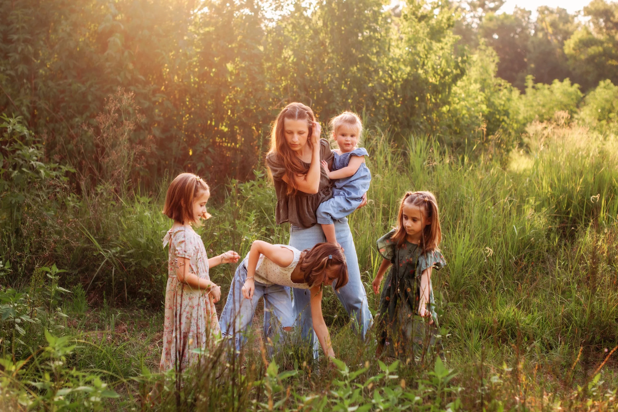 Mom with her four daughters during a family photography session at Camp Mohawk in Alvin, Texas.
