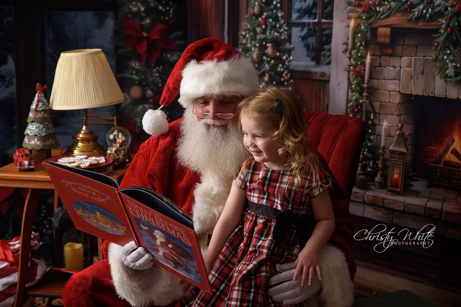 Santa interacting with a child during a Christmas portrait session serving League City families
