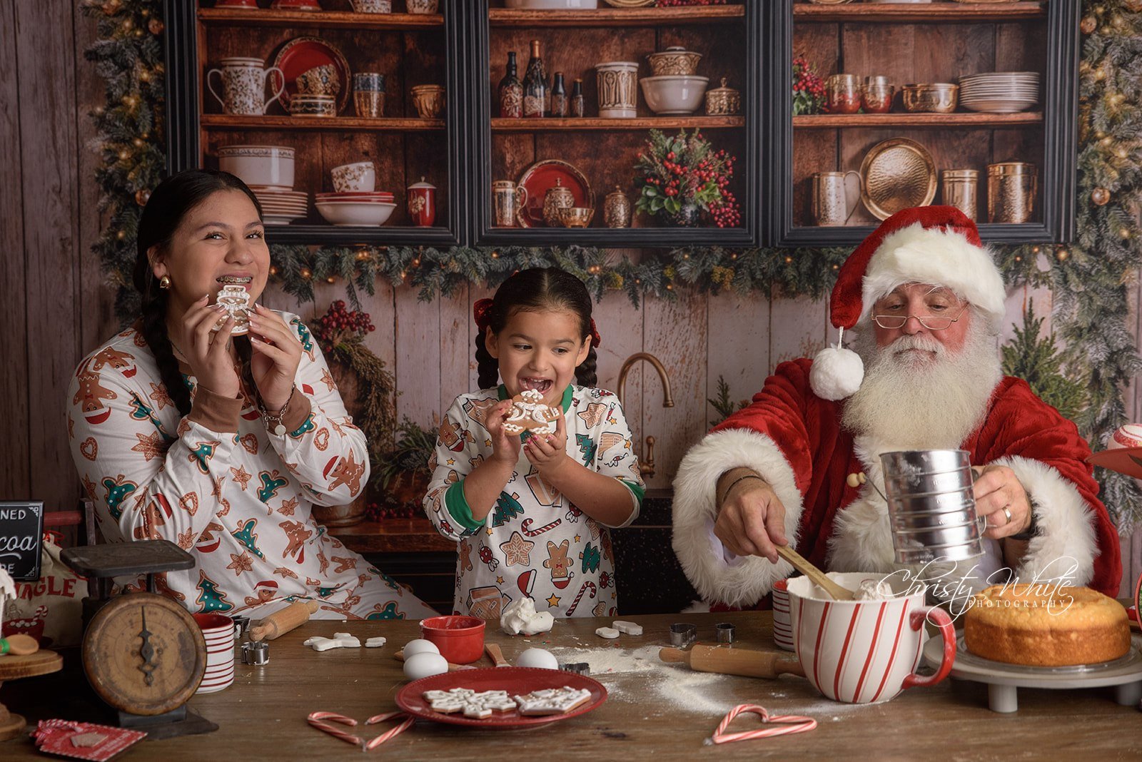 Children decorating Christmas cookies with Santa in Alvin Tx.