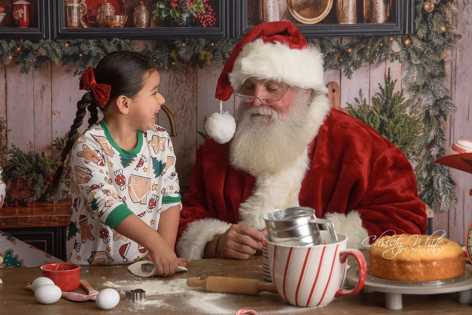 Children decorating Christmas cookies with Santa.