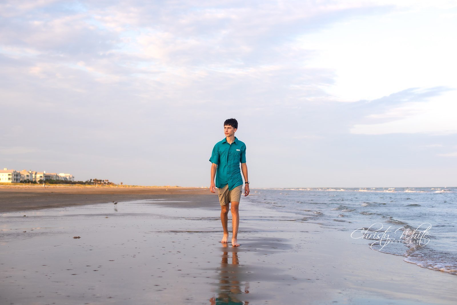 Alvin High School senior during his Class of 2027 senior pictures on the beach in Galveston