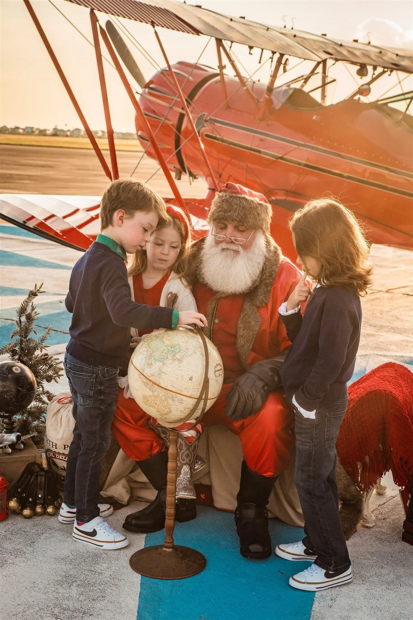 Child helping Santa prepare for Christmas during Santa's Journey in the Galveston Tx area.