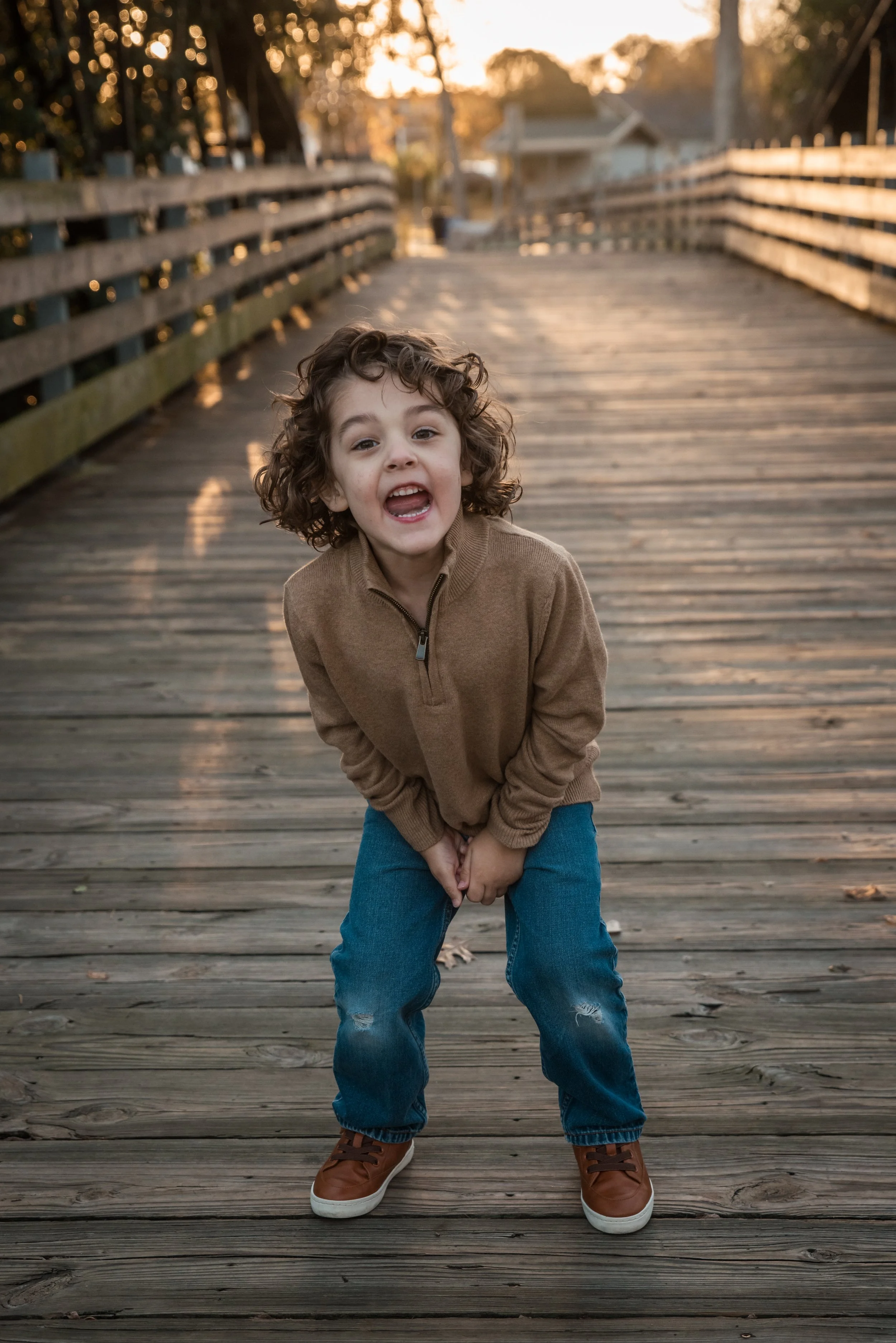 Young child being silly during outdoor photography session in Alvin