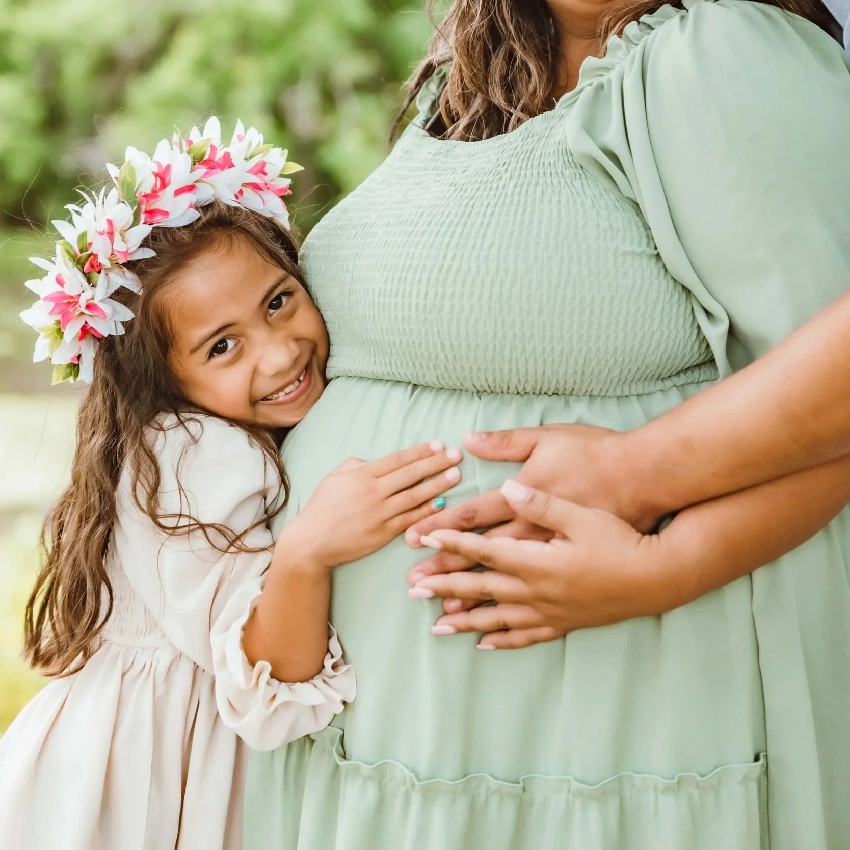 Mother hugging young child during emotional natural maternity photography session in Sugarland Texas