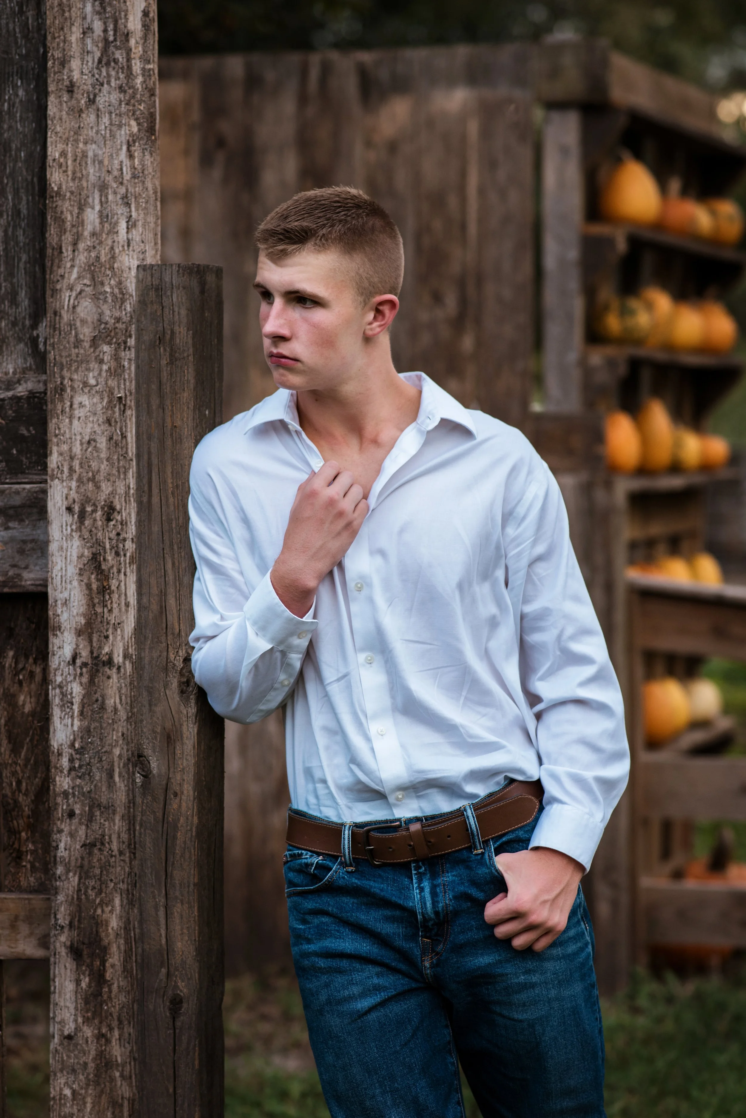 A Pearland Highschool senior boy at a rustic location