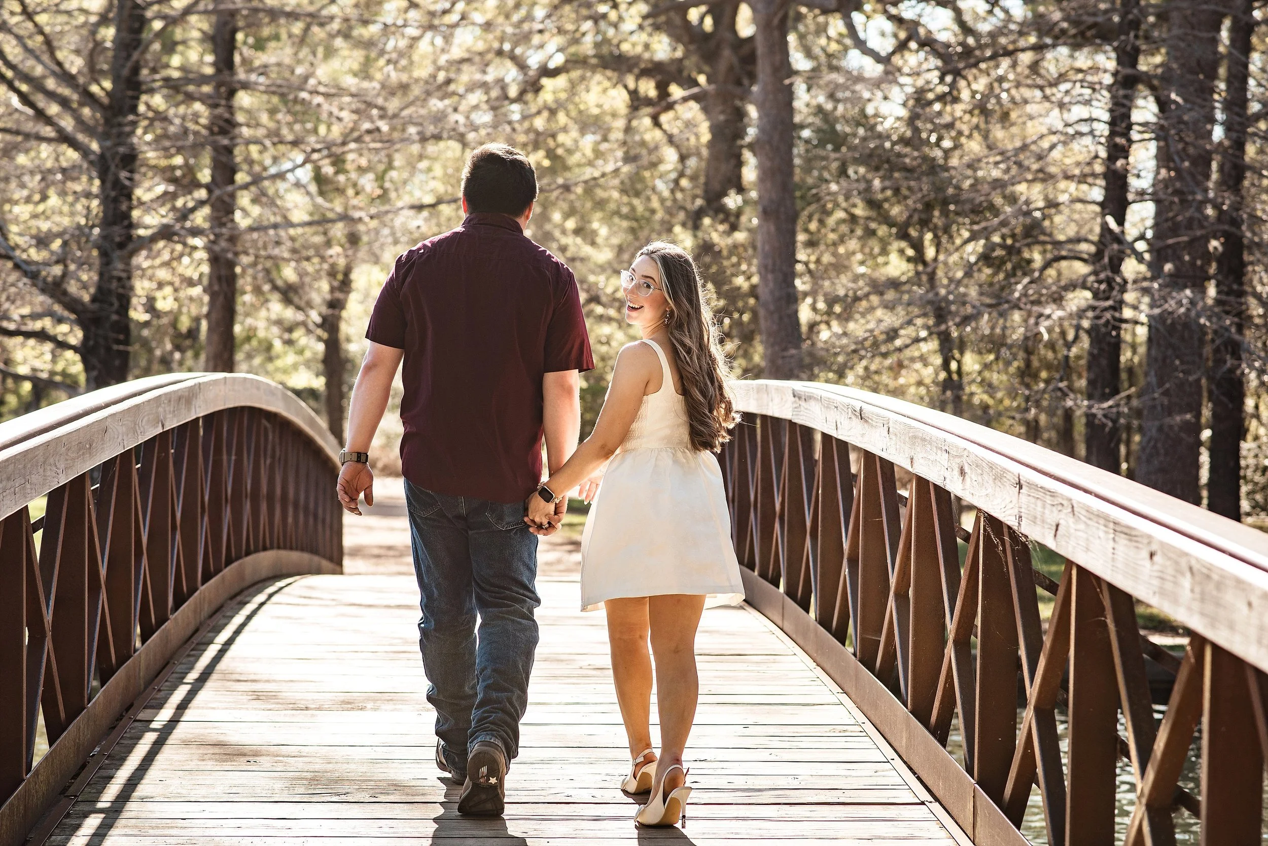 Candid laughing couple during engagement session at Hermann Park Houston natural light photography