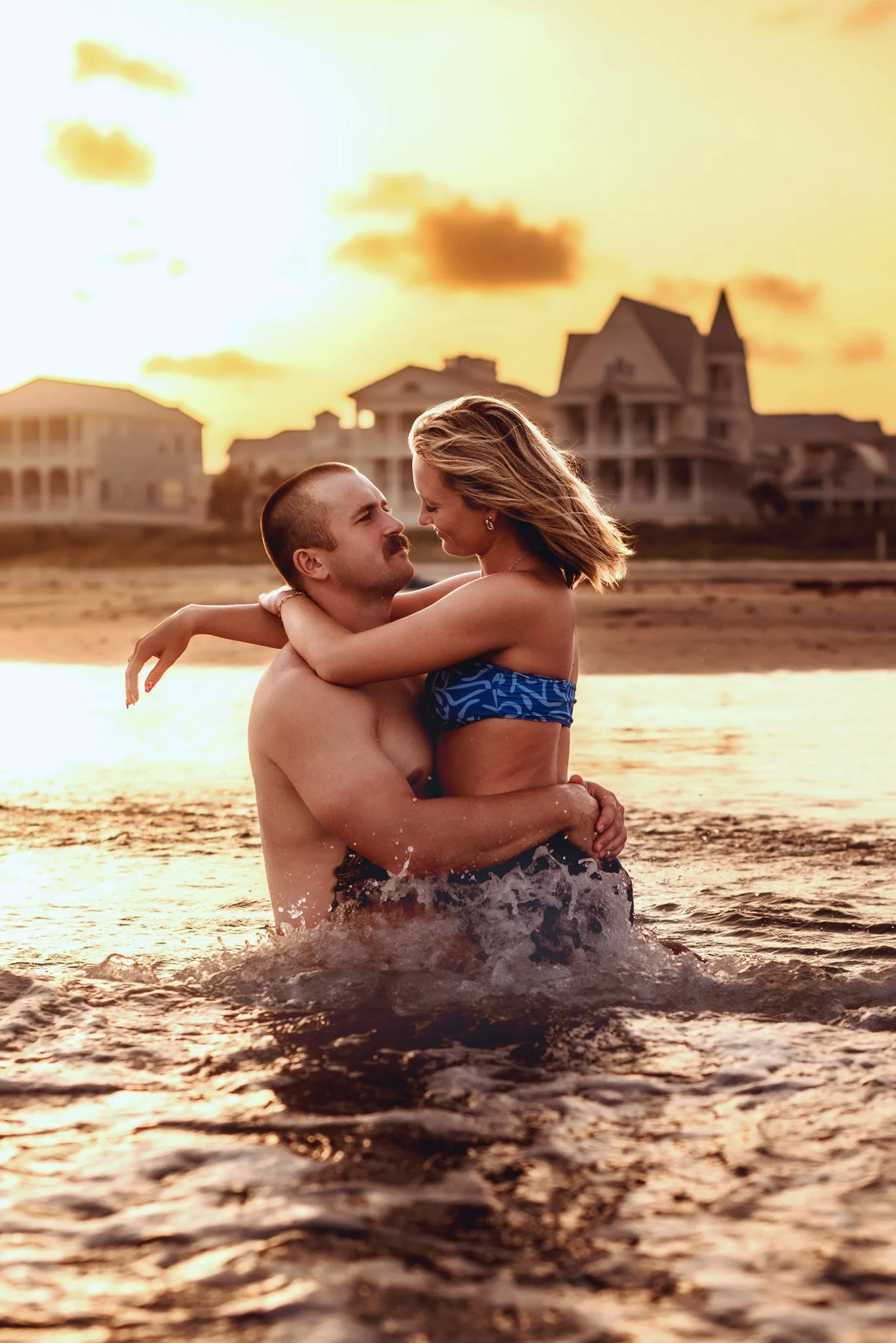 A couple enjoying an evening on a Galveston beach.