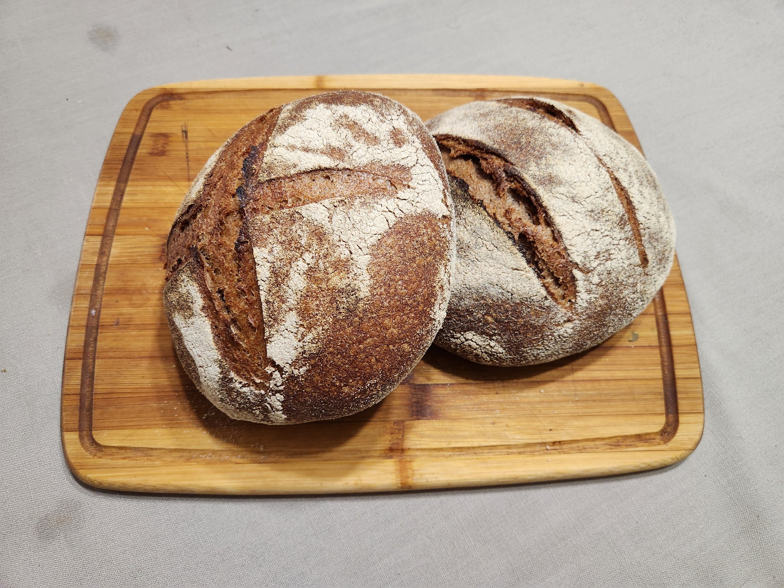 This is the after shot of the previous picture, and is a 100% wheat loaf at 80% hydration with fresh yeast. I tried two slashing techniques depicted in 'El universal convite" for my test loaves.