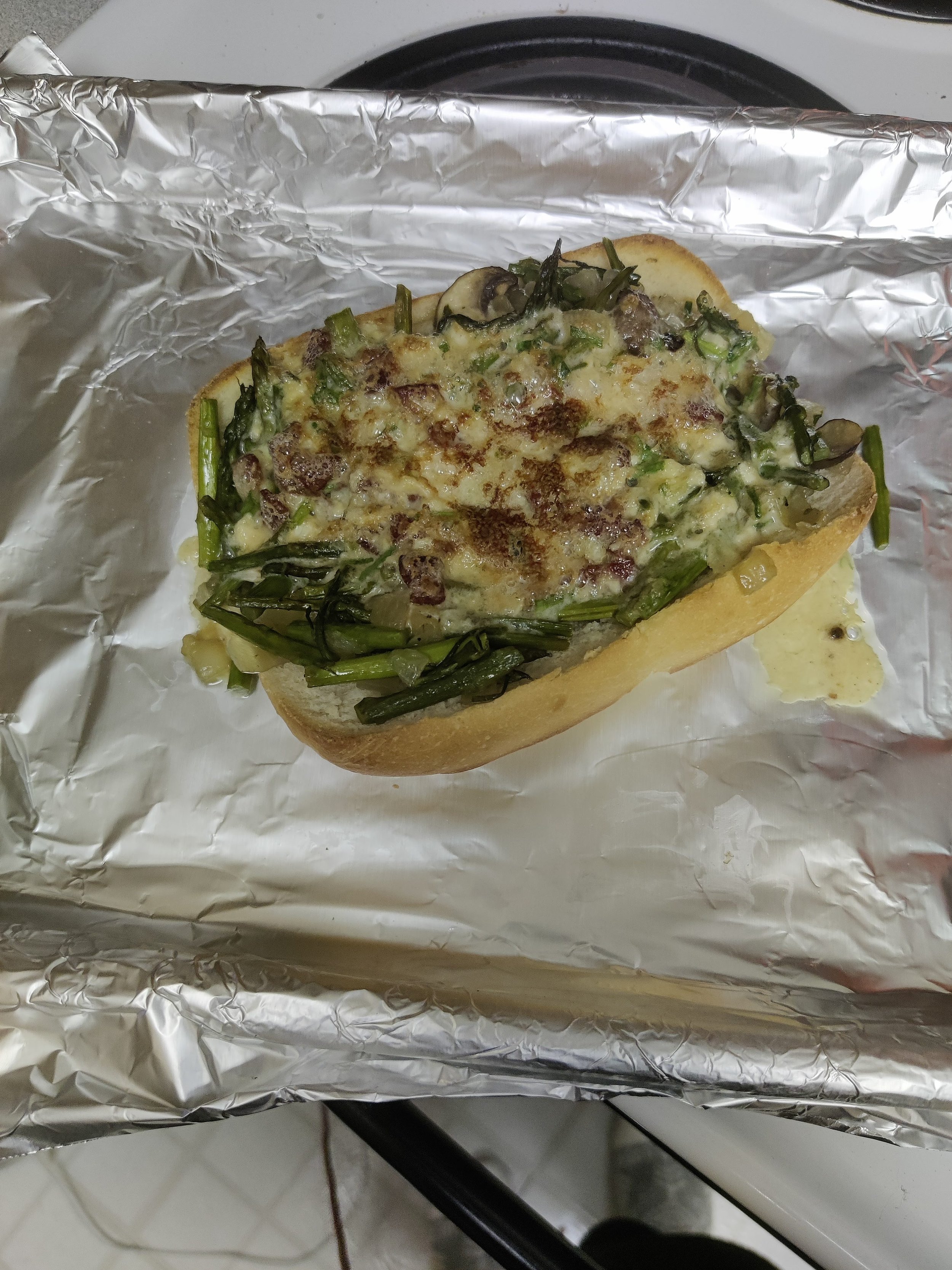 Savory Toasted Cheese is an SCA classic from Sir Kenelem Digby's book. This was made as part of a class I taught on the recipe, and is toasted over bread, asparagus, and mushrooms.