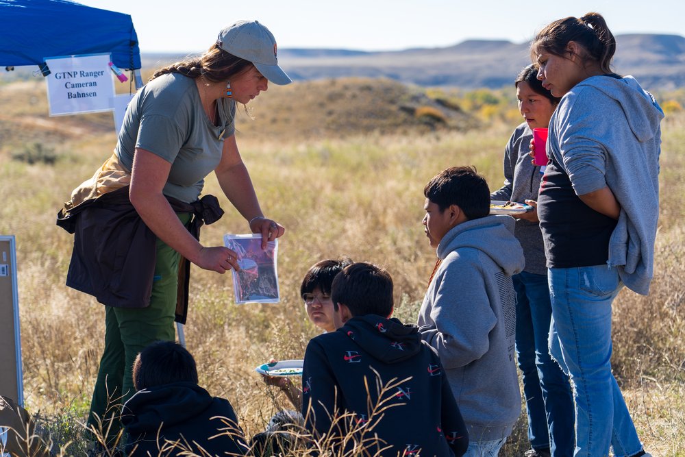  Grand Teton National Park Ranger Cameran Bahnsen speaks with Wyoming Indian School students. (Photo GYC/London Bernier) 