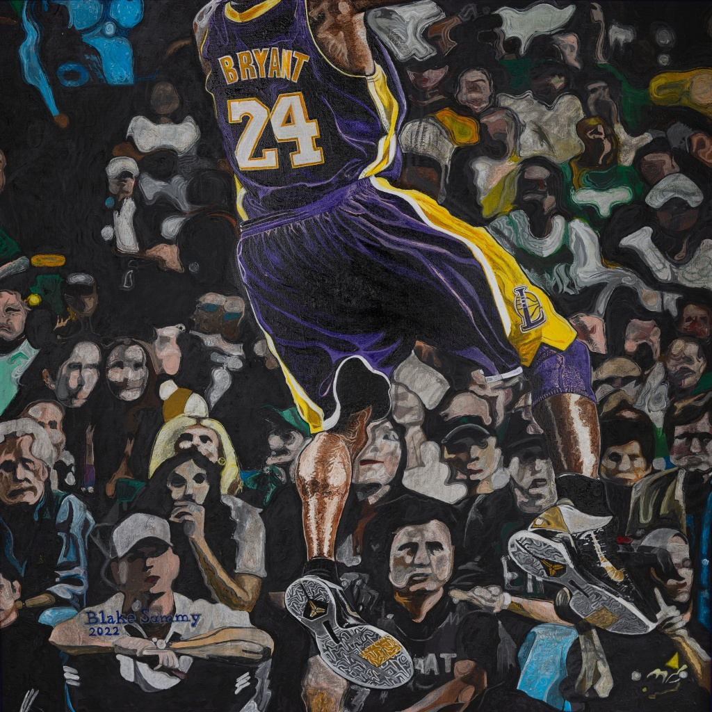 A poster print of Kobe Bryant performing his signature fade away with the crowd watching in the background.