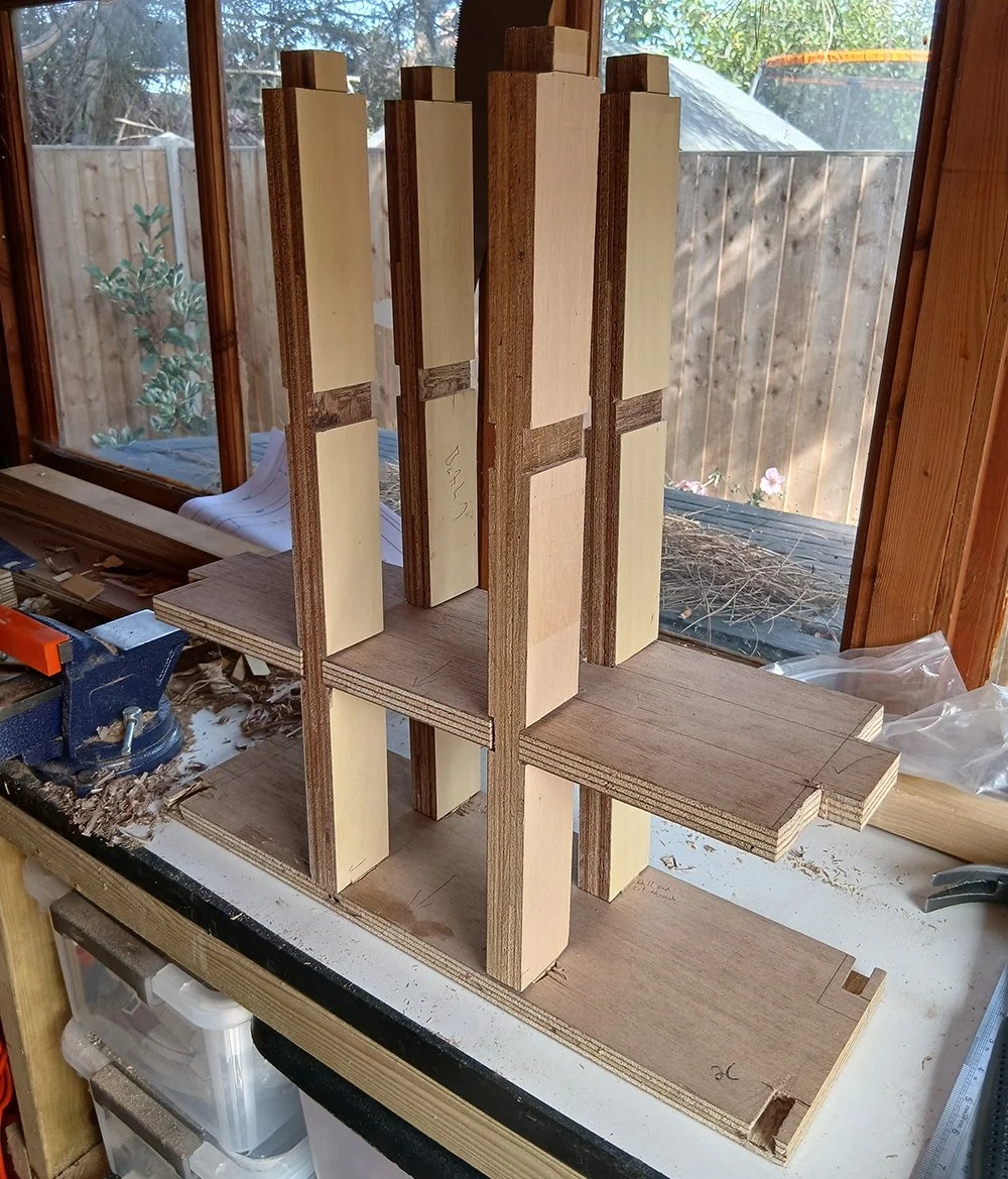 vertical wooden panels are slotted into a bar of wood at the bottom.