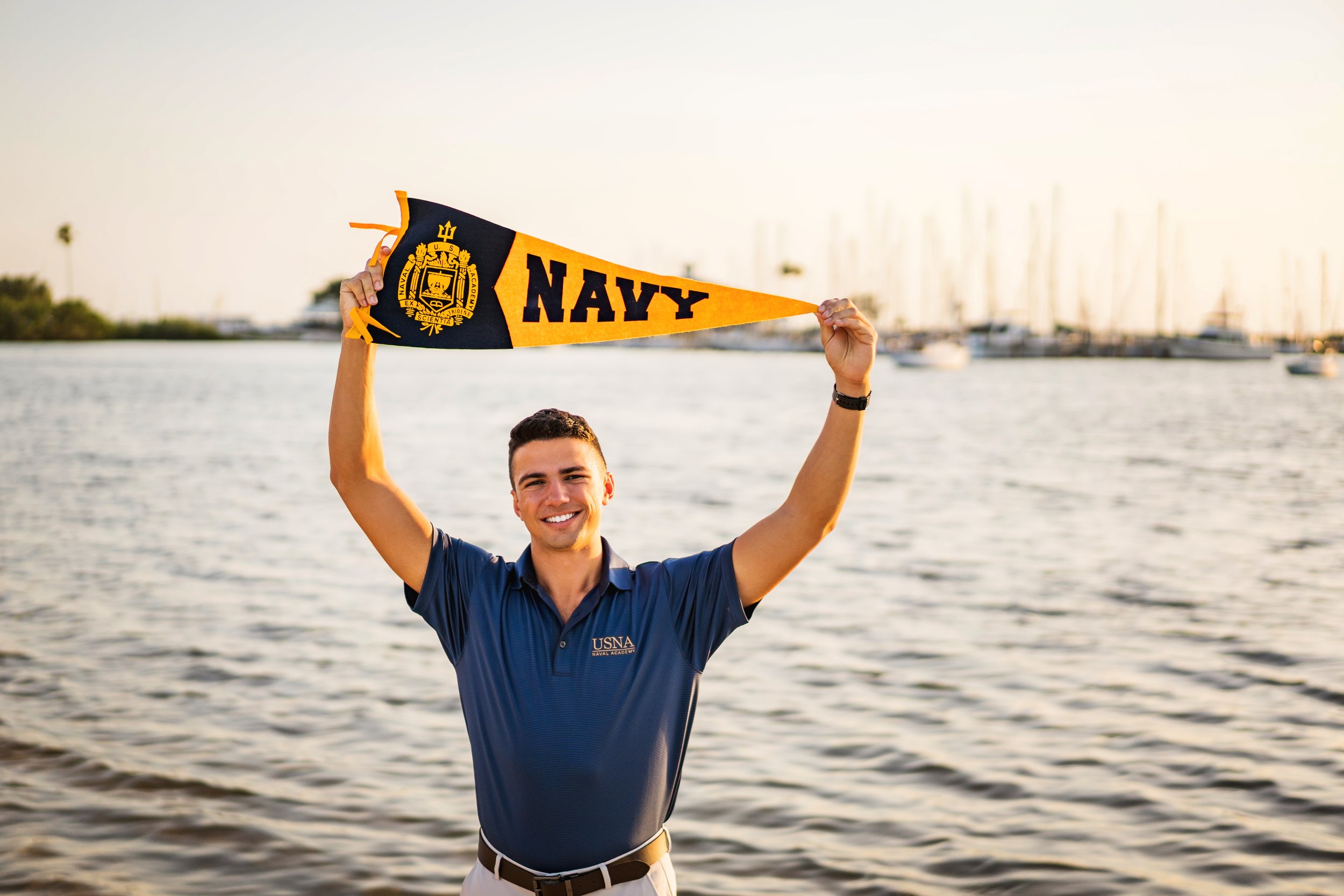 south tampa senior photographer, davis islands senior holding navy penant