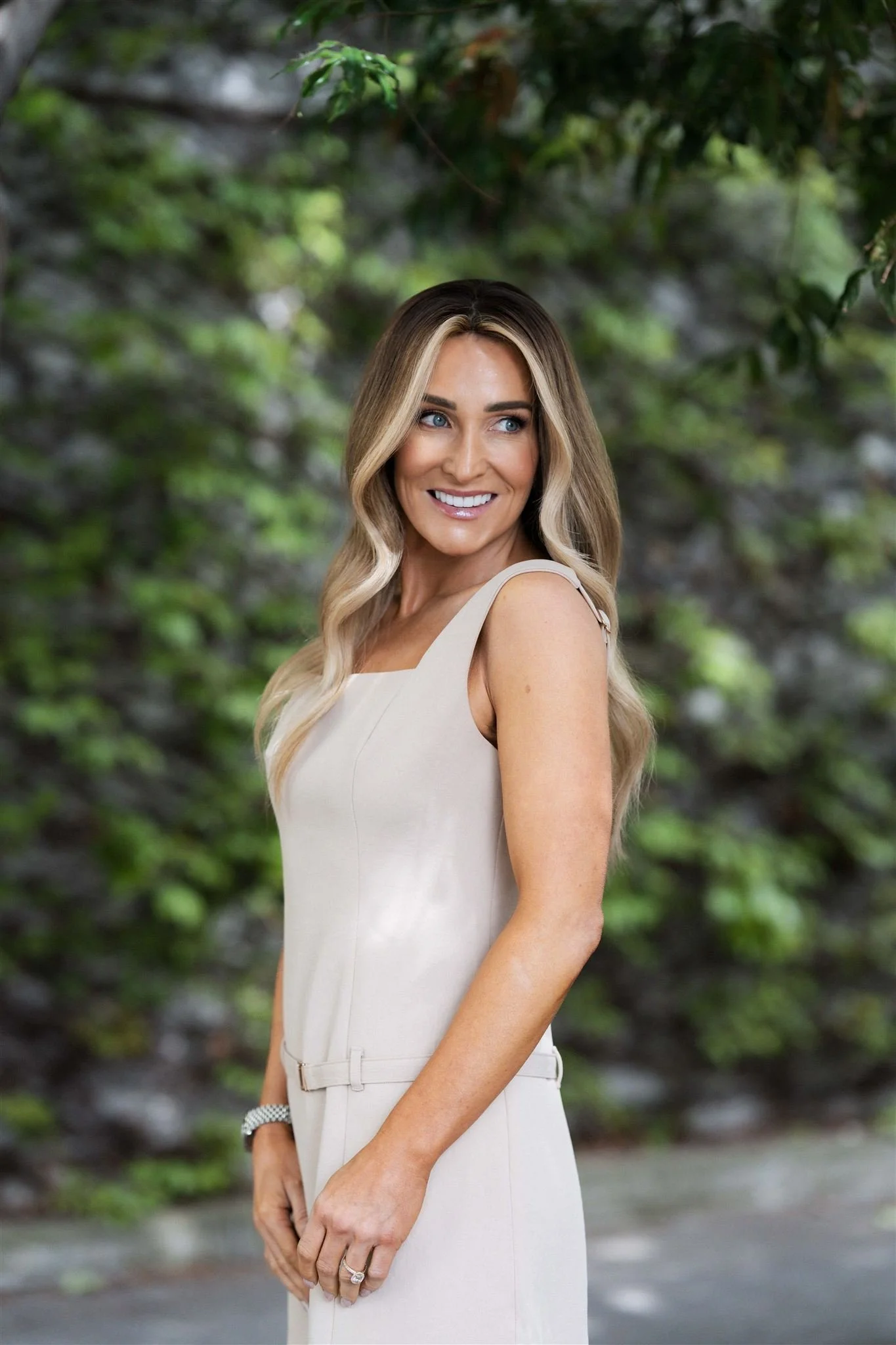 Confident woman after having hair replacement applied at Salon554 in Salem, Oregon