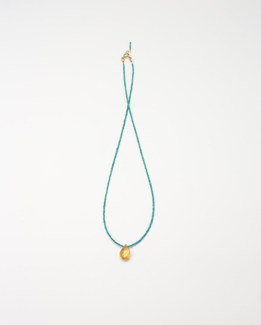 Handmade necklace featuring an citrine briolette on turquoise beads with a gold filled clasp.
