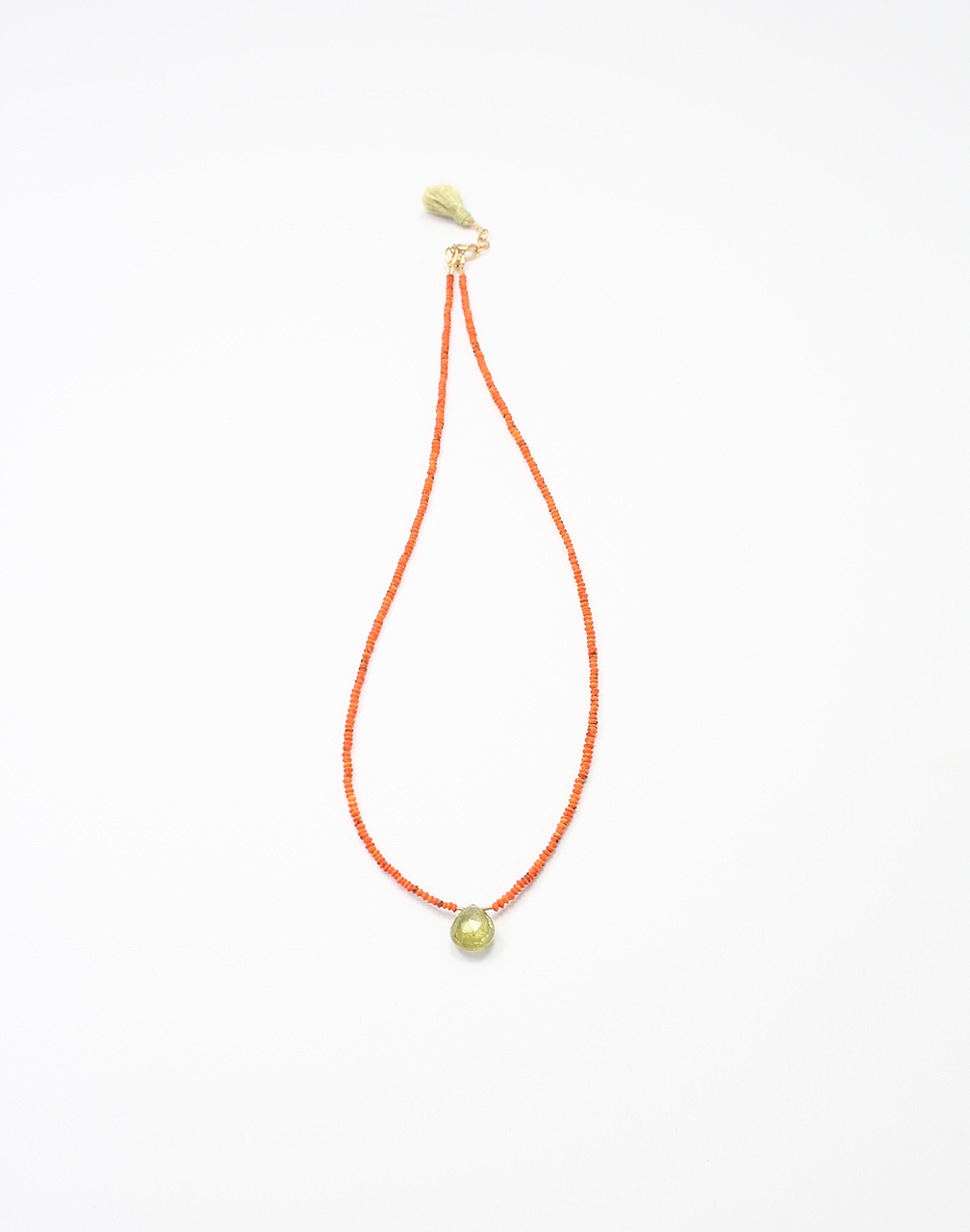 Handmade necklace with green garnet briolette on coral beads, gold filled clasp, and green silk tassel