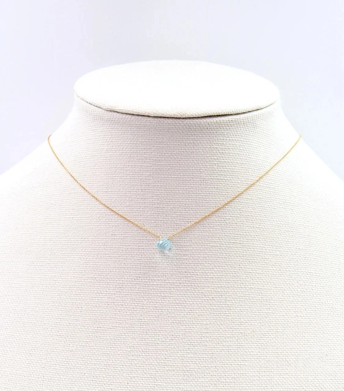 blue topaz gemstone necklace on a delicate gold-filled chain with clasp, minimalist jewelry design