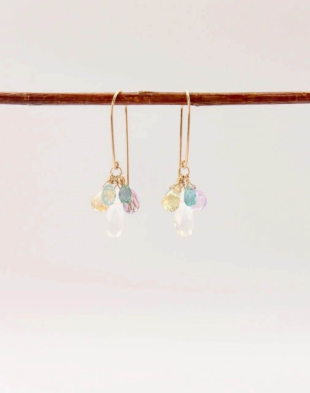 Colorful gemstone cluster earrings with quartz, amethyst, citrine, apatite, and zircon on gold filled ear wires.