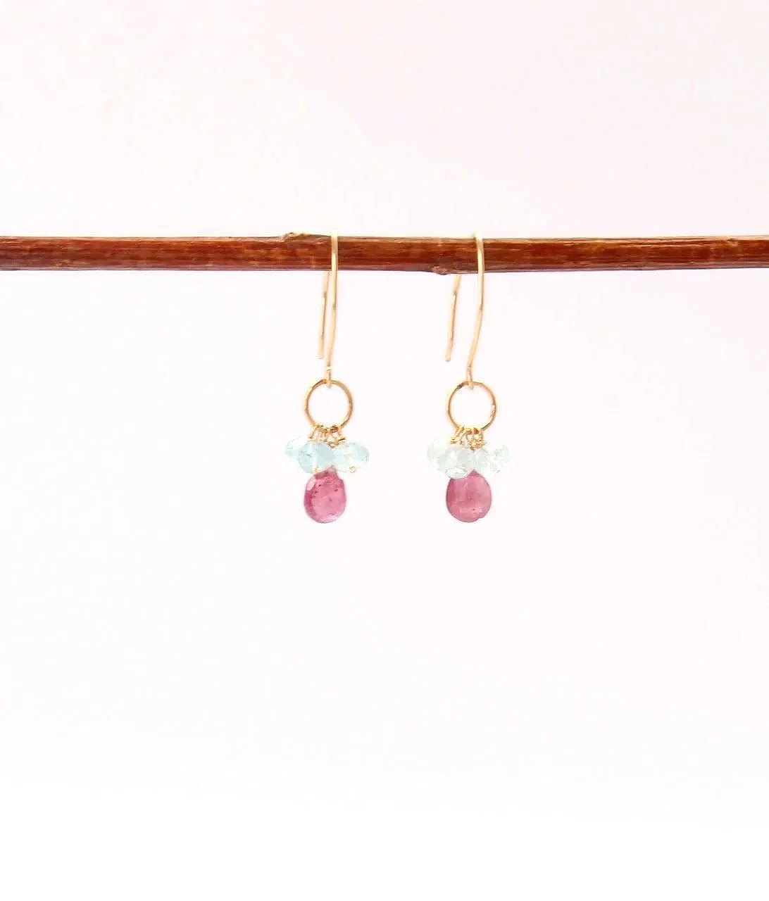 Gold filled earrings featuring pink tourmaline and aquamarine gemstone drops.