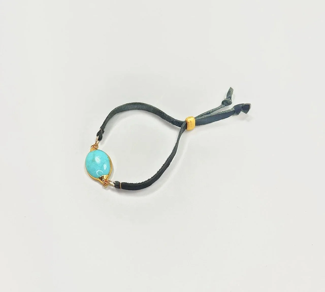 Vermeil bezeled turquoise bracelet on navy leather with vermeil pull clasp