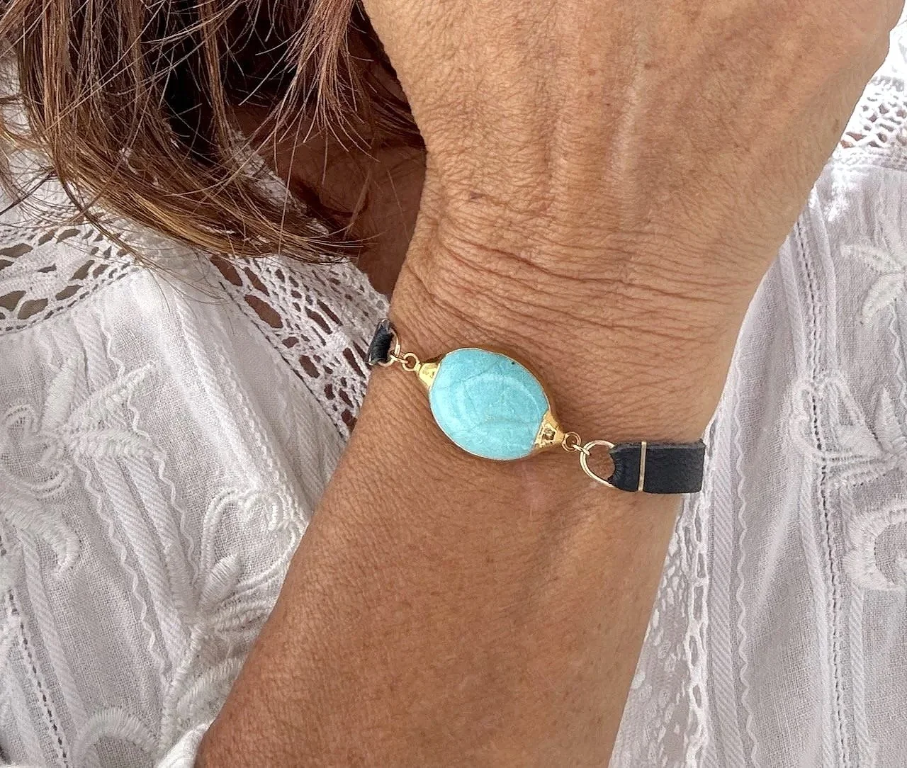 Vermeil bezeled turquoise bracelet on navy leather with vermeil pull clasp