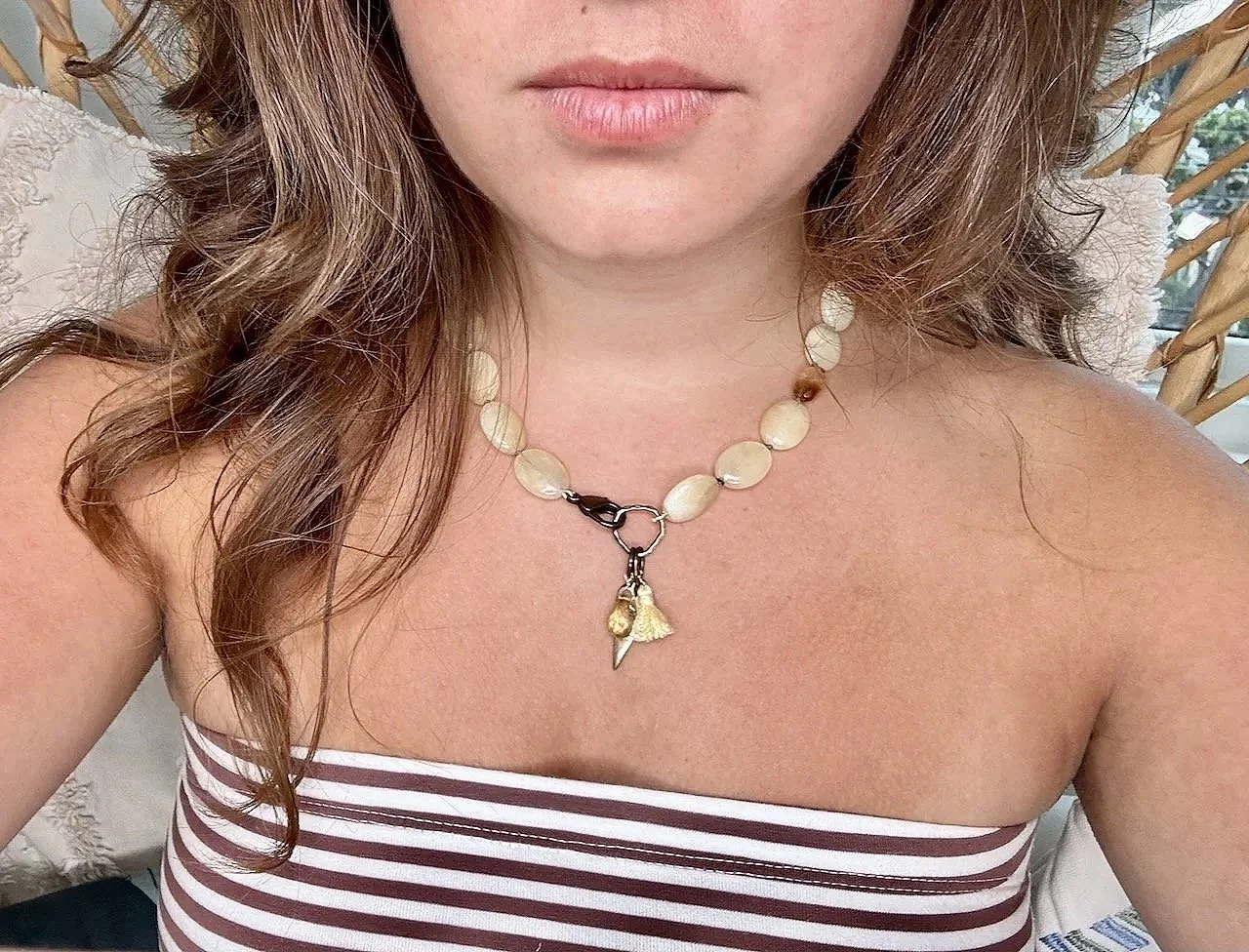 Yellow aventurine knotted with light brown thread, citrine nuggets, antique brass lobster clasp with heart charm, citrine briolette, yellow silk tassel