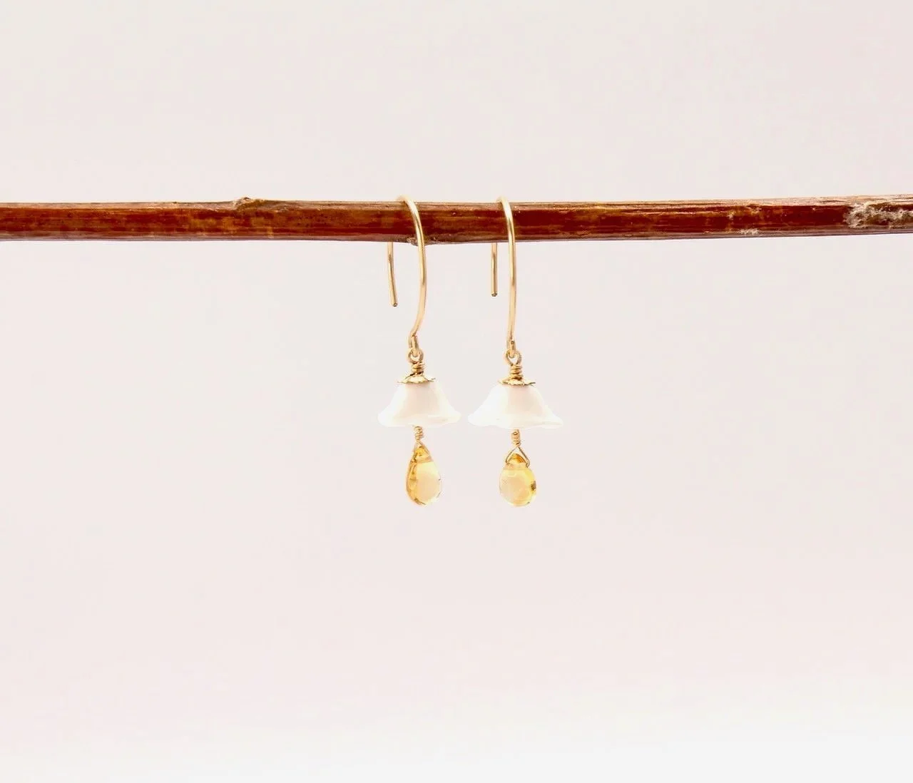 Gold filled earrings with vintage white glass flowers and citrine gemstone accents.