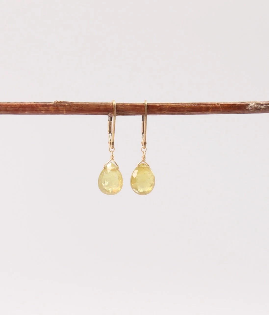 Green garnet teardrop earrings on gold filled lever back ear wires.