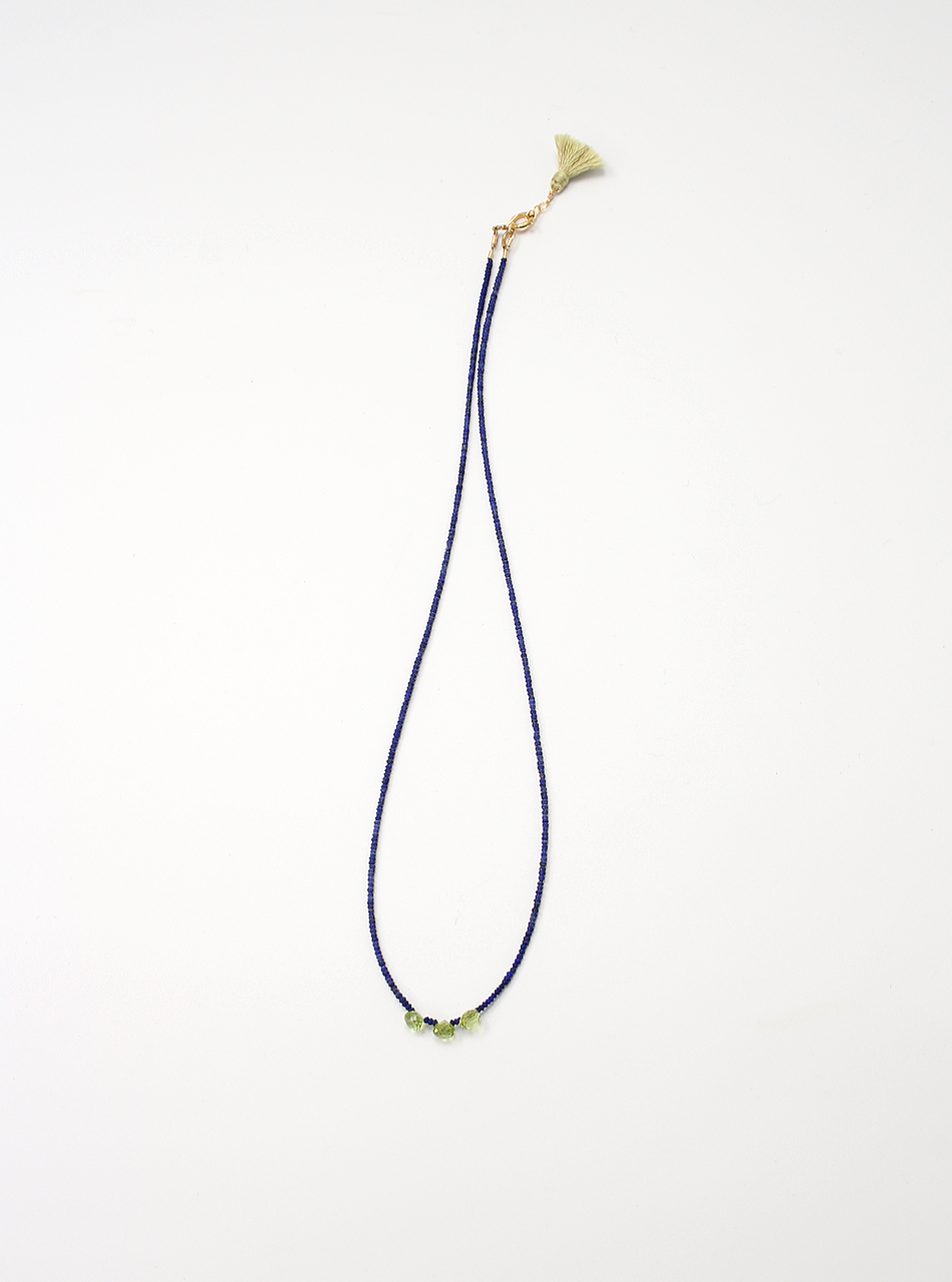 Handmade necklace with three peridot briolettes on lapis lazuli beads, finished with a gold filled clasp and green silk tassel.