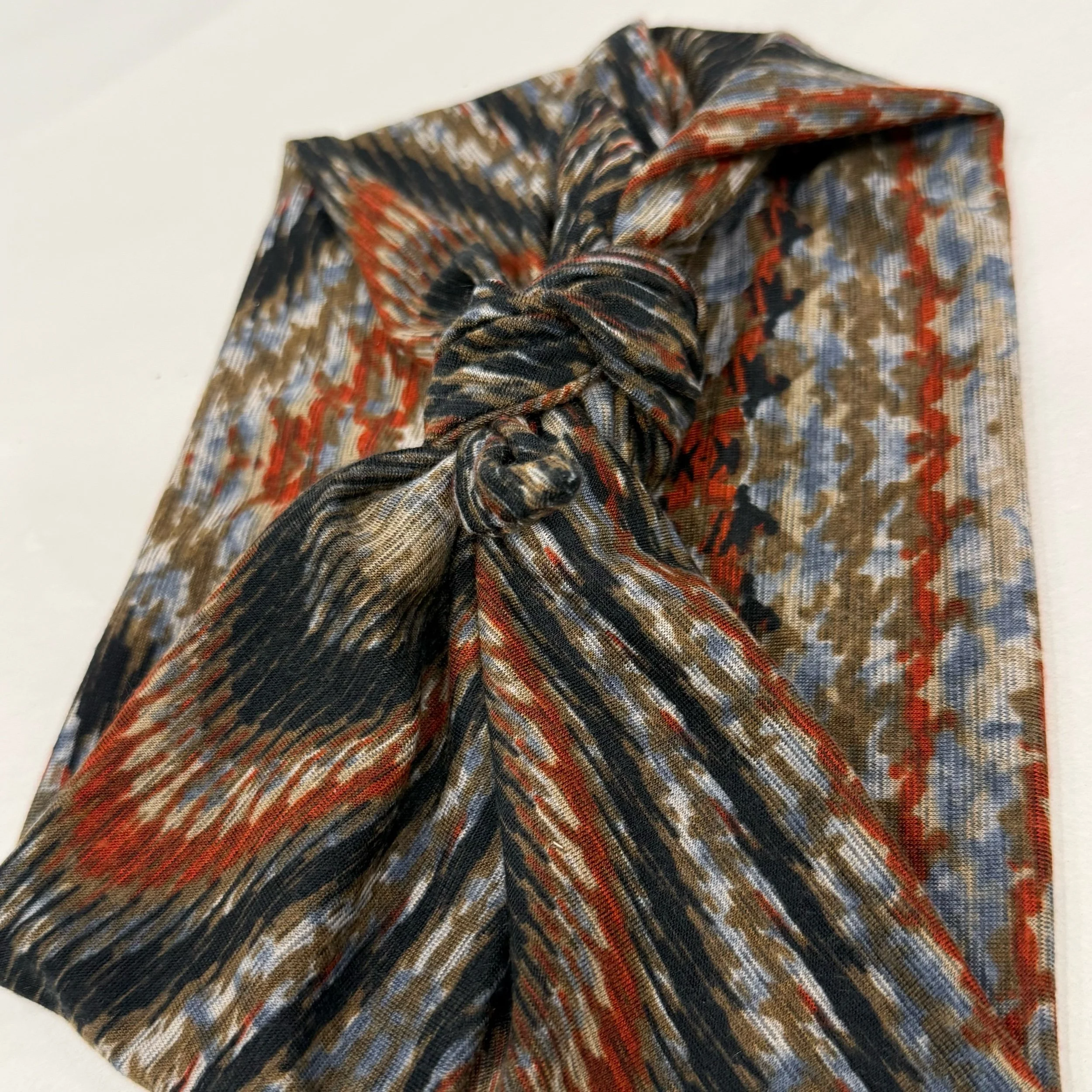 Adjustable muted wood grain stretch  fabric headband with colorful printed design, handmade by Seams by Sarah