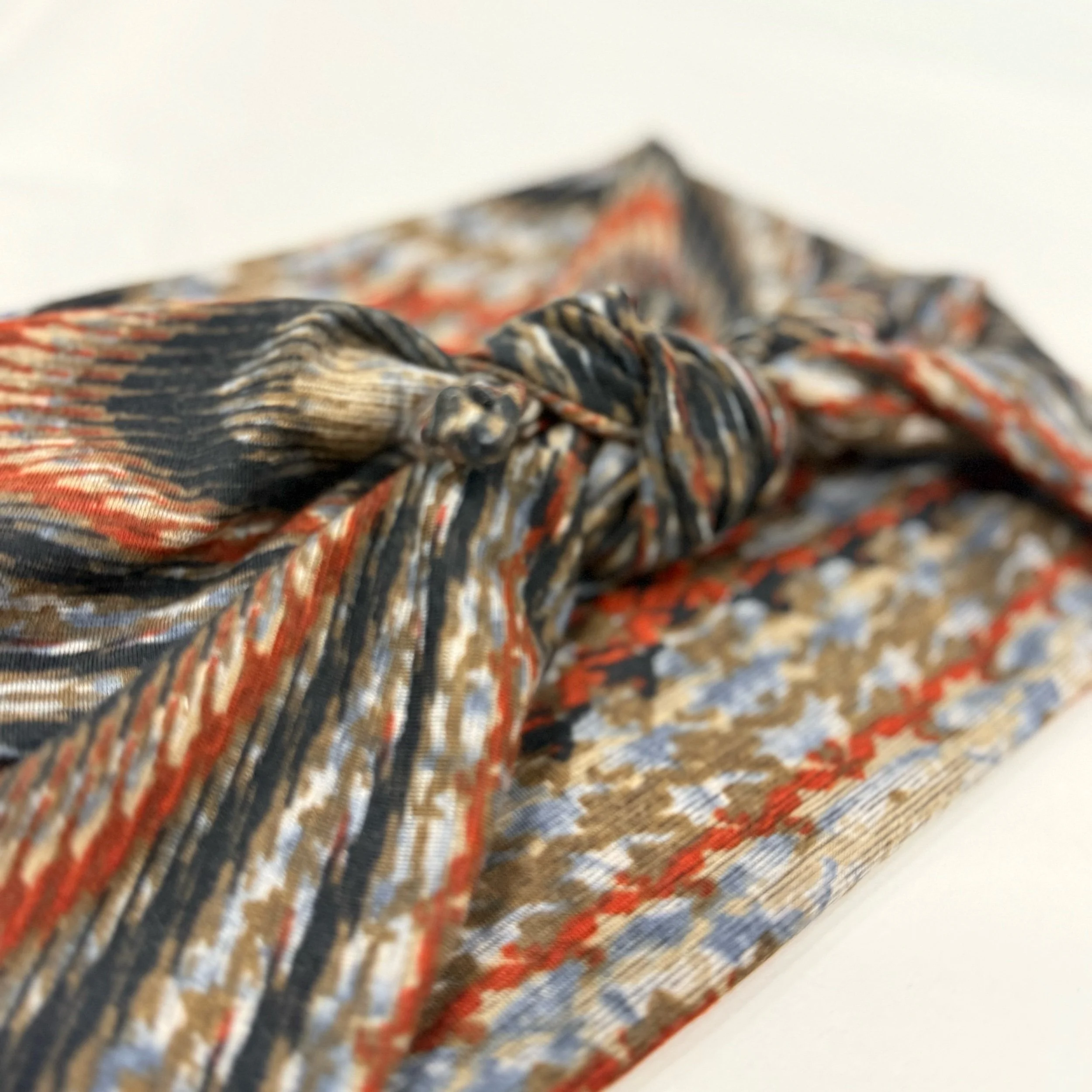 Adjustable muted wood grain stretch  fabric headband with colorful printed design, handmade by Seams by Sarah