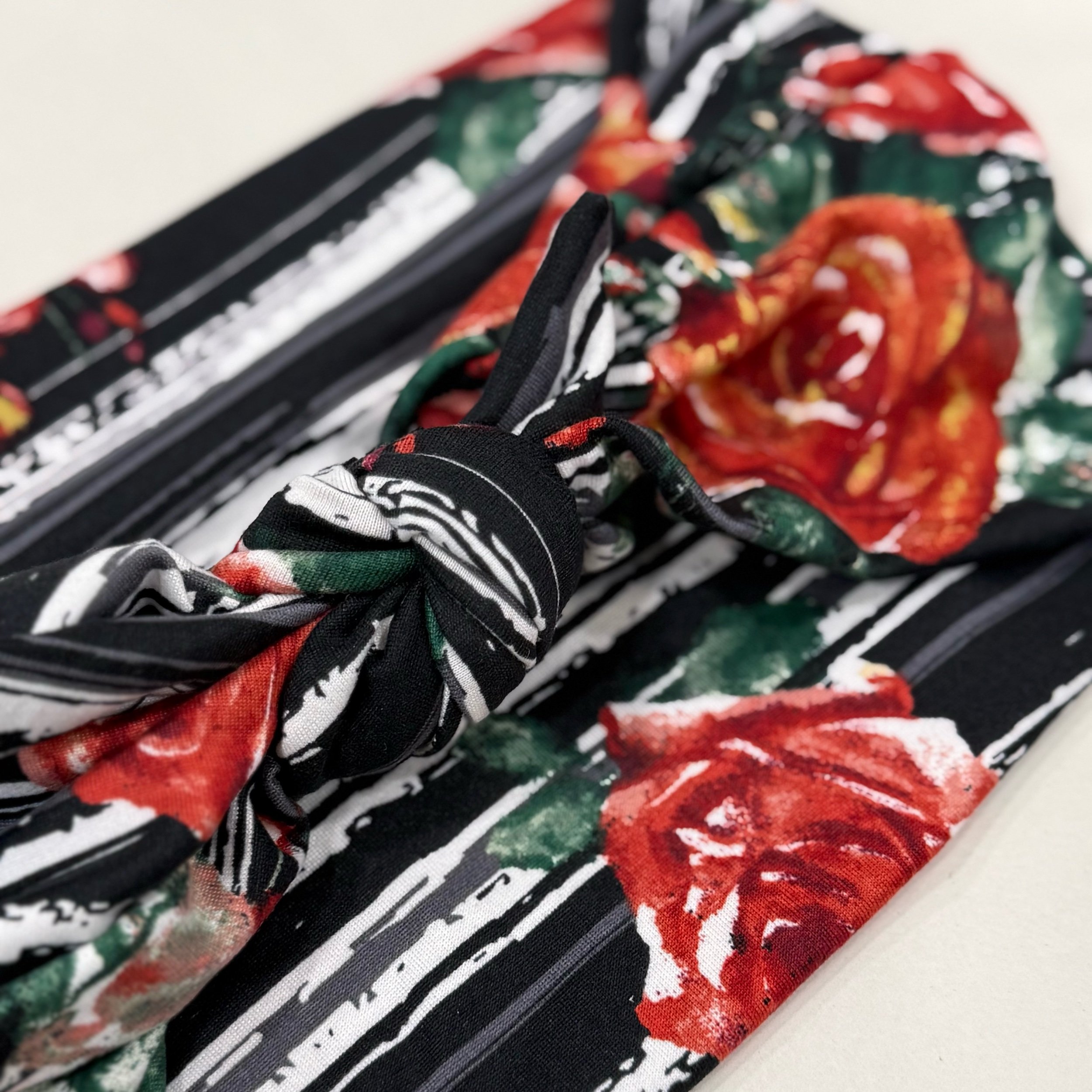 A headband that is Adjustable. It is sewn with  Animal print stretch fabric. To complete the headband you can tie in a square knot. Seams by Sarah