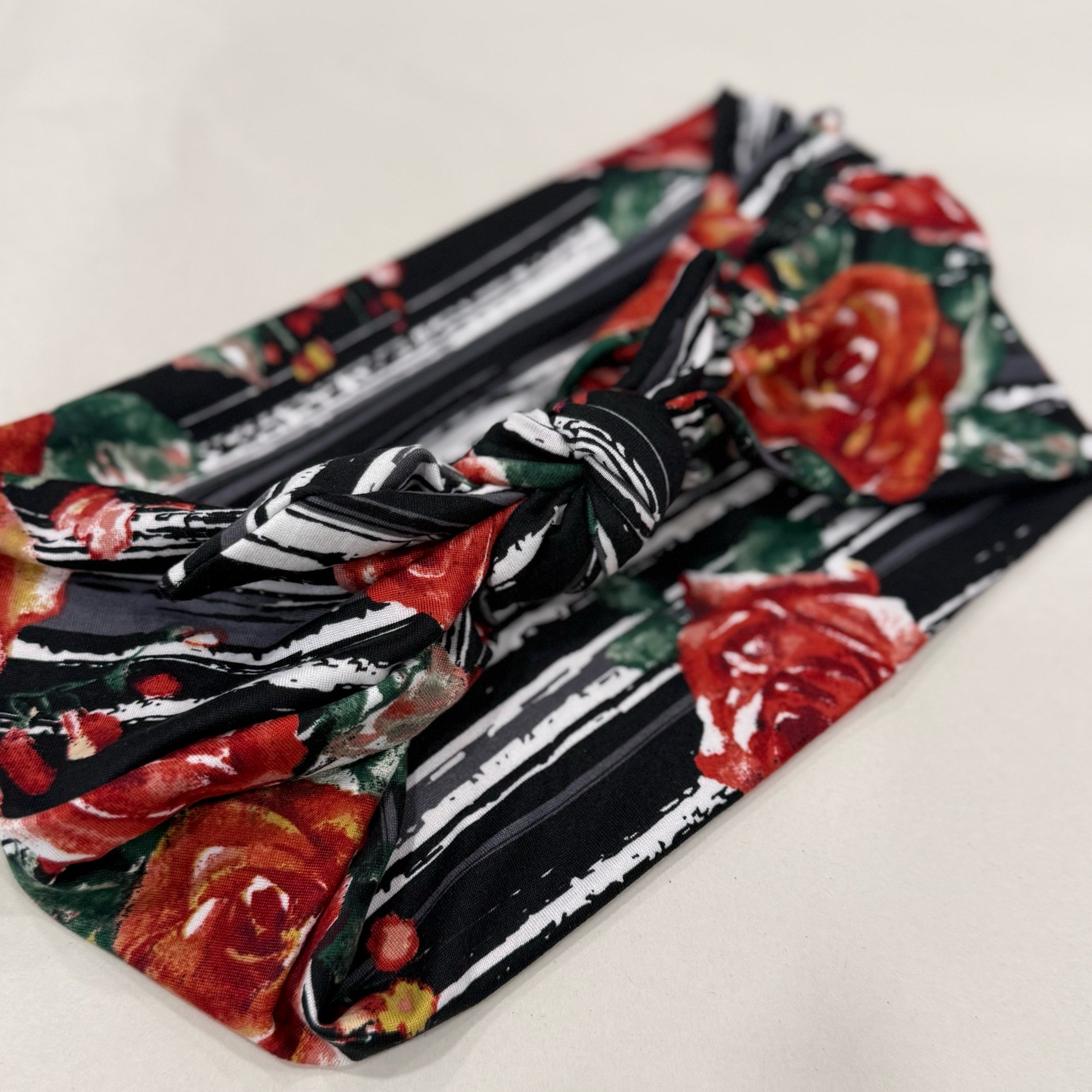 A headband that is Adjustable. It is sewn with  Animal print stretch fabric. To complete the headband you can tie in a square knot. Seams by Sarah