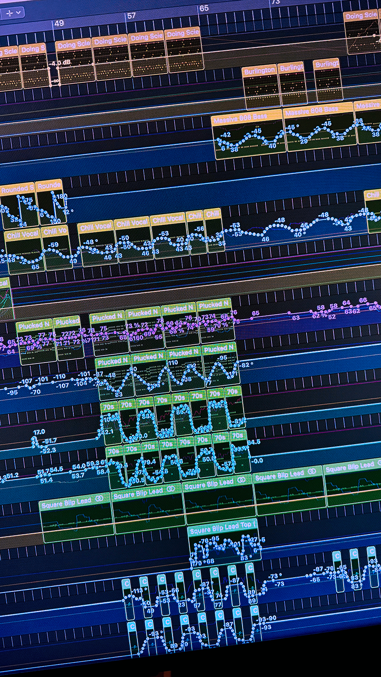 Digital audio workstation screen displaying multiple tracks in a digital music production project, including waveforms, automation lines, and labels such as 'Doing Science,' 'Burlington,' 'Massive 808 Bass,' and 'Chill Vocal.'