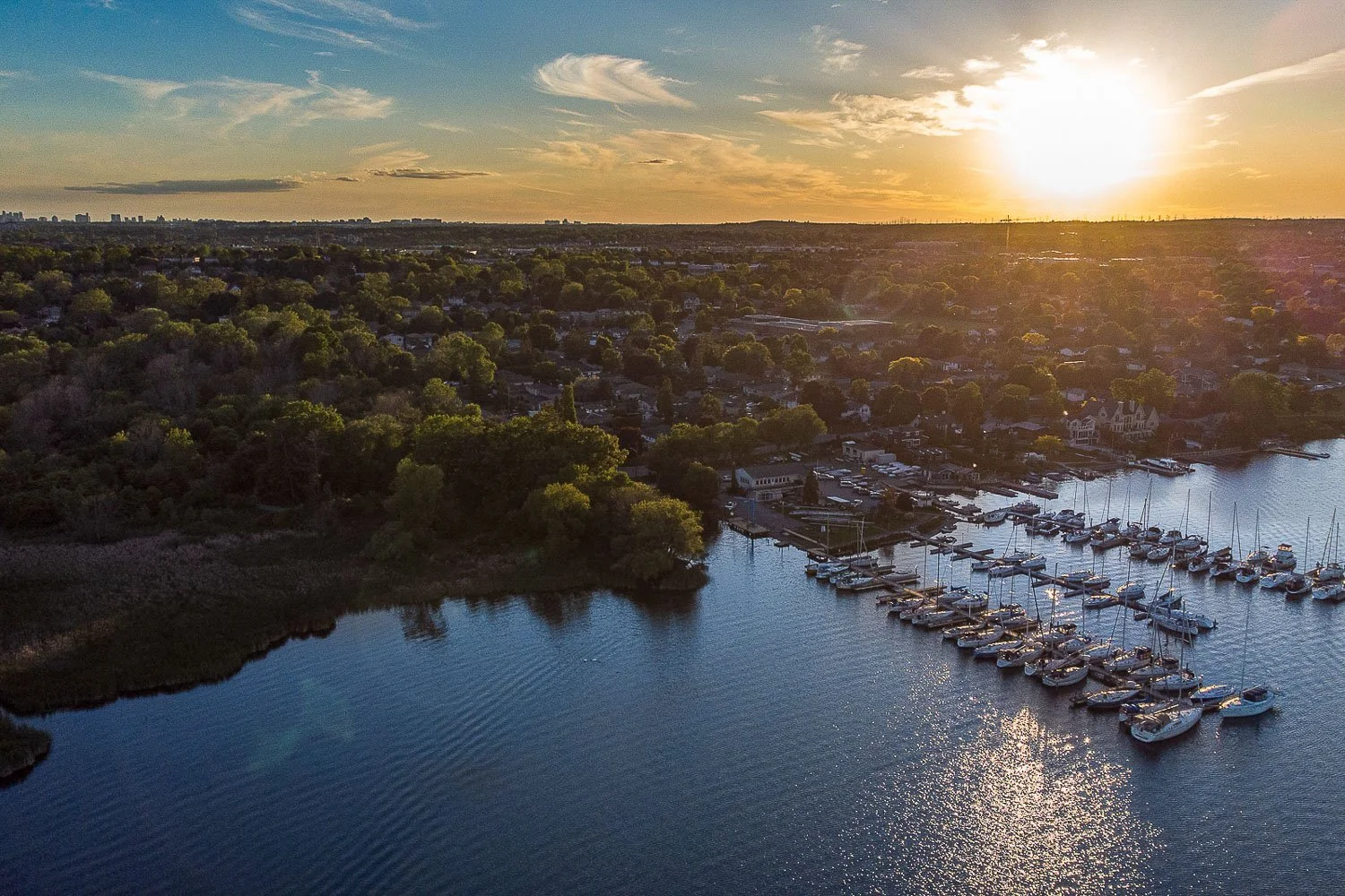 Aerial view of waterfront marina at sunset